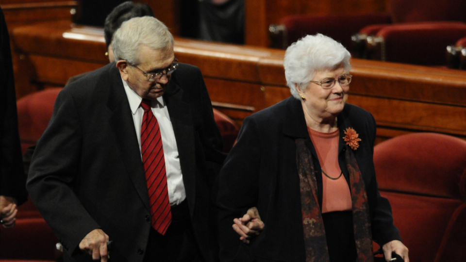 President Boyd K. Packer leaves the October 2010 general conference with his wife, Donna. Sister Donna Packer died Saturday night in her home at age 94.