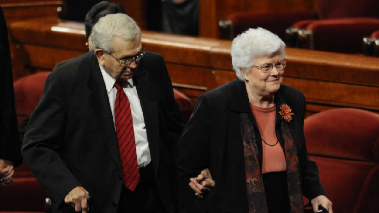 President Boyd K. Packer leaves the October 2010 general conference with his wife, Donna. Sister Donna Packer died Saturday night in her home at age 94.