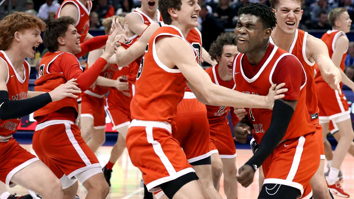 American Fork celebrates their 6A boys basketball state championship win against Corner Canyon at BYU in Provo on Saturday, March 5, 2022.