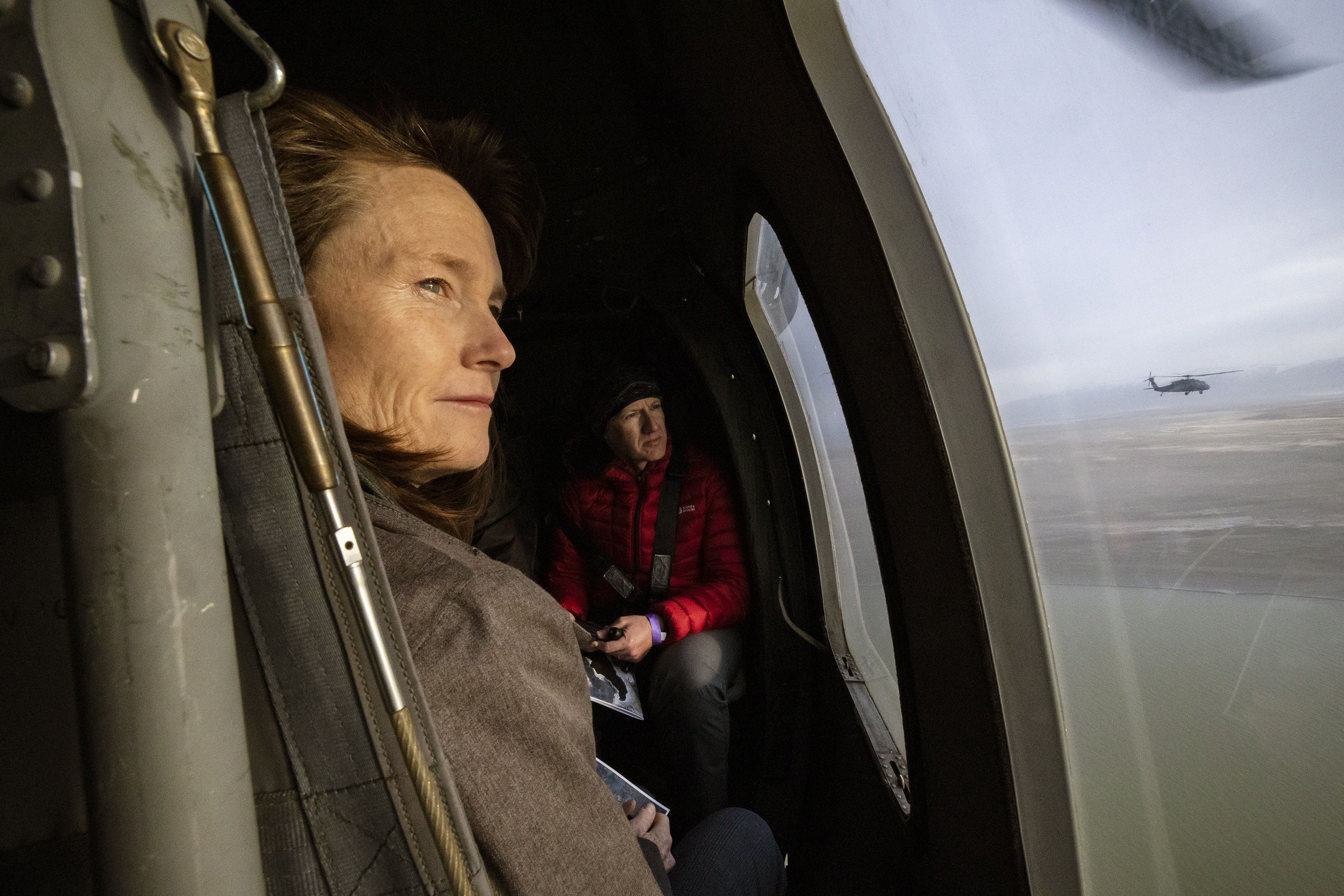 Sen. Kathleen Riebe, D-Cottonwood Heights, and Rep. Jeffrey Stenquist, R-Draper, look out the windows as they and other Utah lawmakers take an aerial tour of the Great Salt Lake by Blackhawk helicopters from the Air National Guard. The group left from the Capitol in Salt Lake City Utah on Feb. 15.