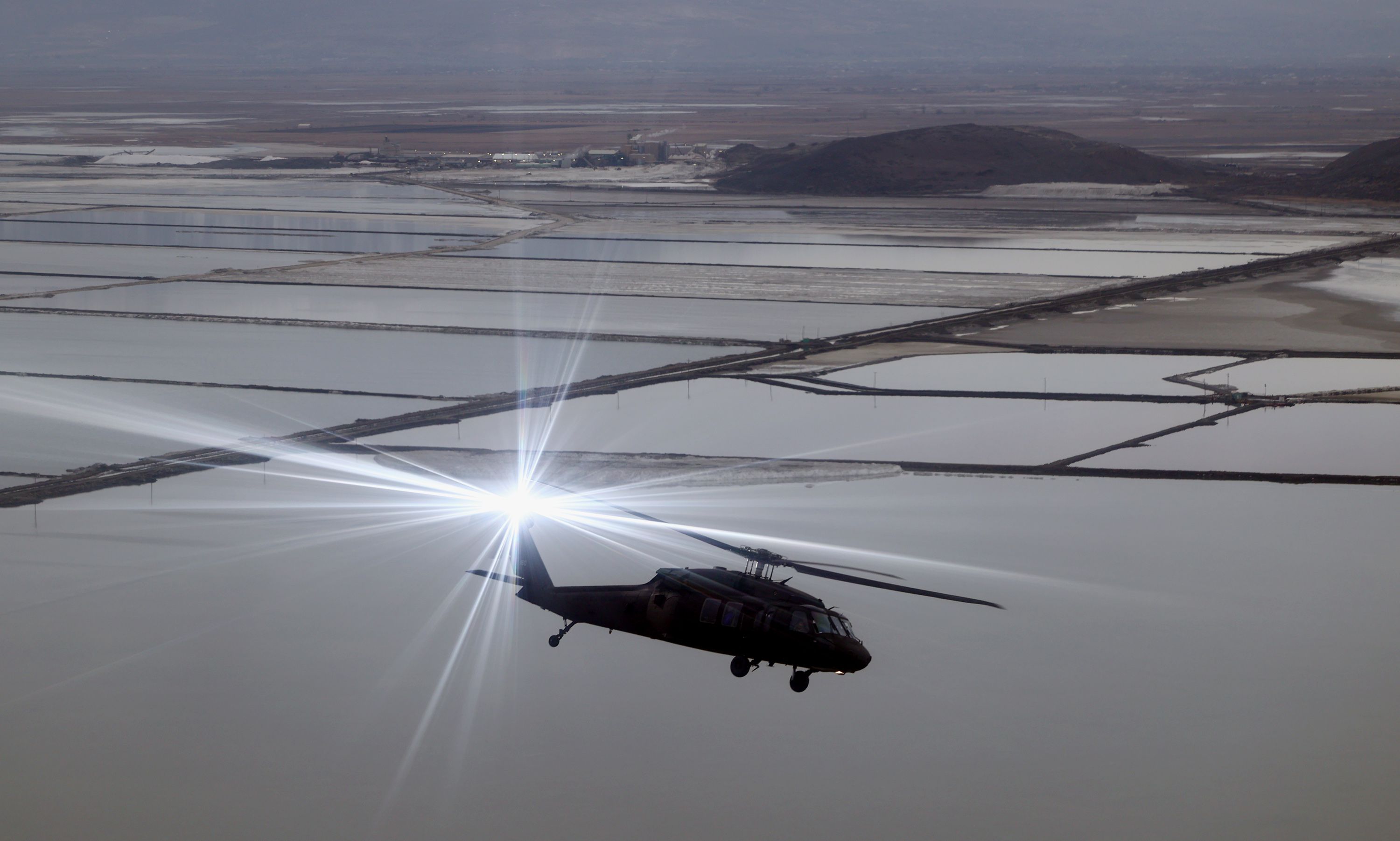 The anti-collision light flashes on one of three Utah Army National Guard Blackhawks as they transport Utah lawmakers on an aerial tour of the Great Salt Lake on Feb. 15. They left from the Capitol in Salt Lake City, Utah.