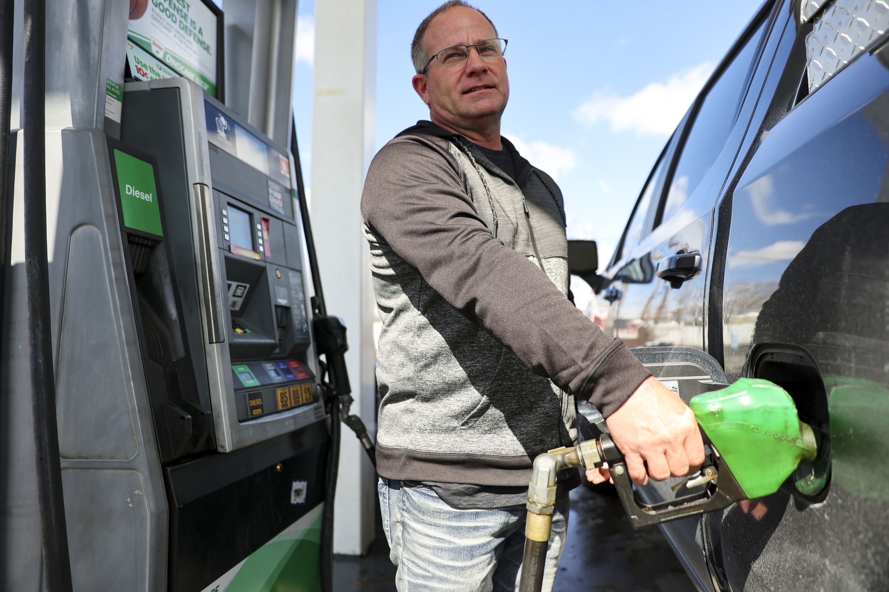 Troy Naylor pumps gas into his truck at a Sinclair in Salt Lake City on Monday. The average U.S. cost of gas crossed the $4 per gallon threshold over the weekend for the first time since 2008.