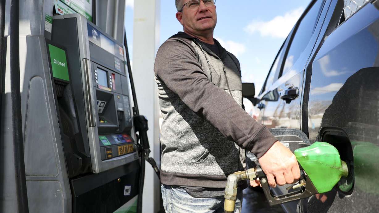 Troy Naylor pumps gas into his truck at a Sinclair in Salt Lake City on Monday. The average U.S. cost of gas crossed the $4 per gallon threshold over the weekend for the first time since 2008.