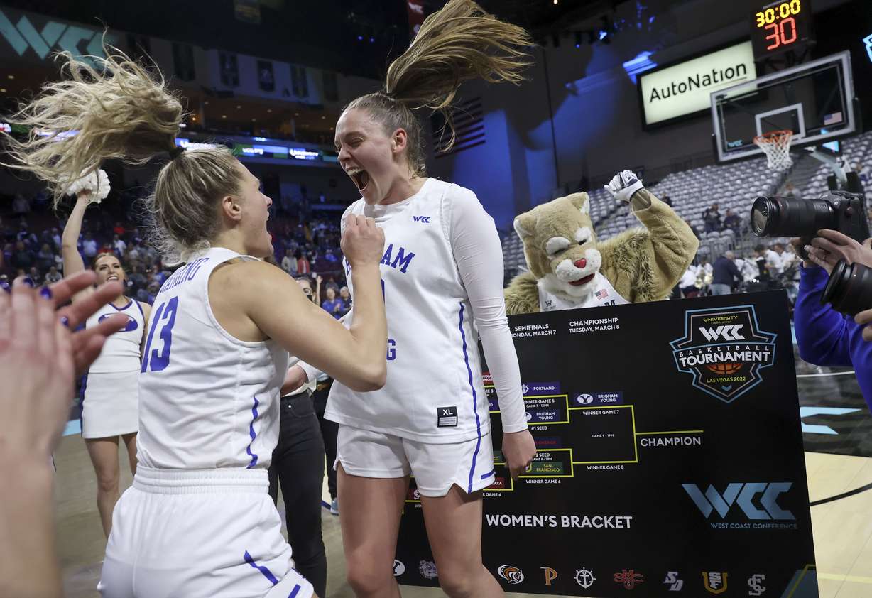 BYU Cougars guard Paisley Harding (13) and BYU Cougars guard Tegan Graham (10) celebrate making it to the final round of the 2022 WCC Women's Basketball Tournament semifinals after beating the Portland Pilots at the Orleans Arena in Las Vegas on Monday, March 7. BYU won 59-52.