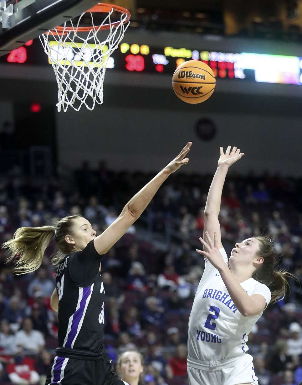 BYU guard Shaylee Gonzales (2) shoots as Portland forward Lucy Cochrane (30) guards her in the 2022 WCC Women's Basketball Tournament semifinals at the Orleans Arena in Las Vegas on Monday, March 7, 2022. BYU won 59-52.