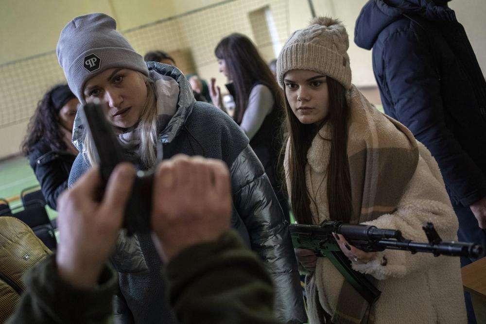 Ukrainian civilians receive weapons training, in the outskirts of Lviv, western Ukraine, Monday. Russia's invasion of Ukraine has entered its 12th day following what Ukrainian authorities described as increased shelling of encircled cities and another failed attempt to evacuate civilians from the port of Mariupol. Russia announced yet another cease-fire and humanitarian corridors to allow civilians to flee Ukraine on Monday but nothing has happened so far. Two previous cease-fire attempts failed.