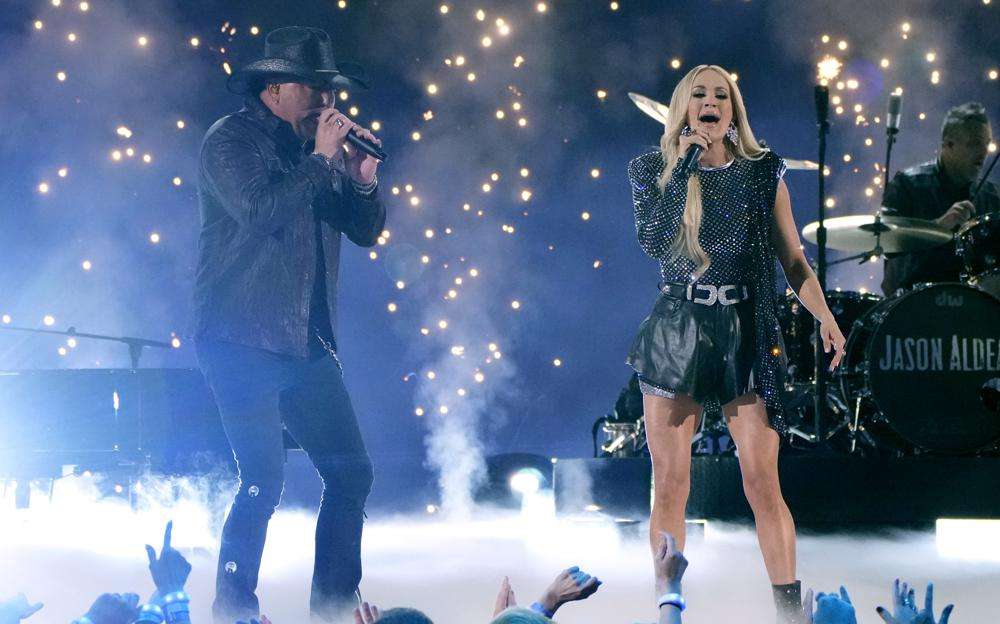 Jason Aldean, left, and Carrie Underwood perform "If I Didn't Love You" at the 57th Academy of Country Music Awards on Monday at Allegiant Stadium in Las Vegas.