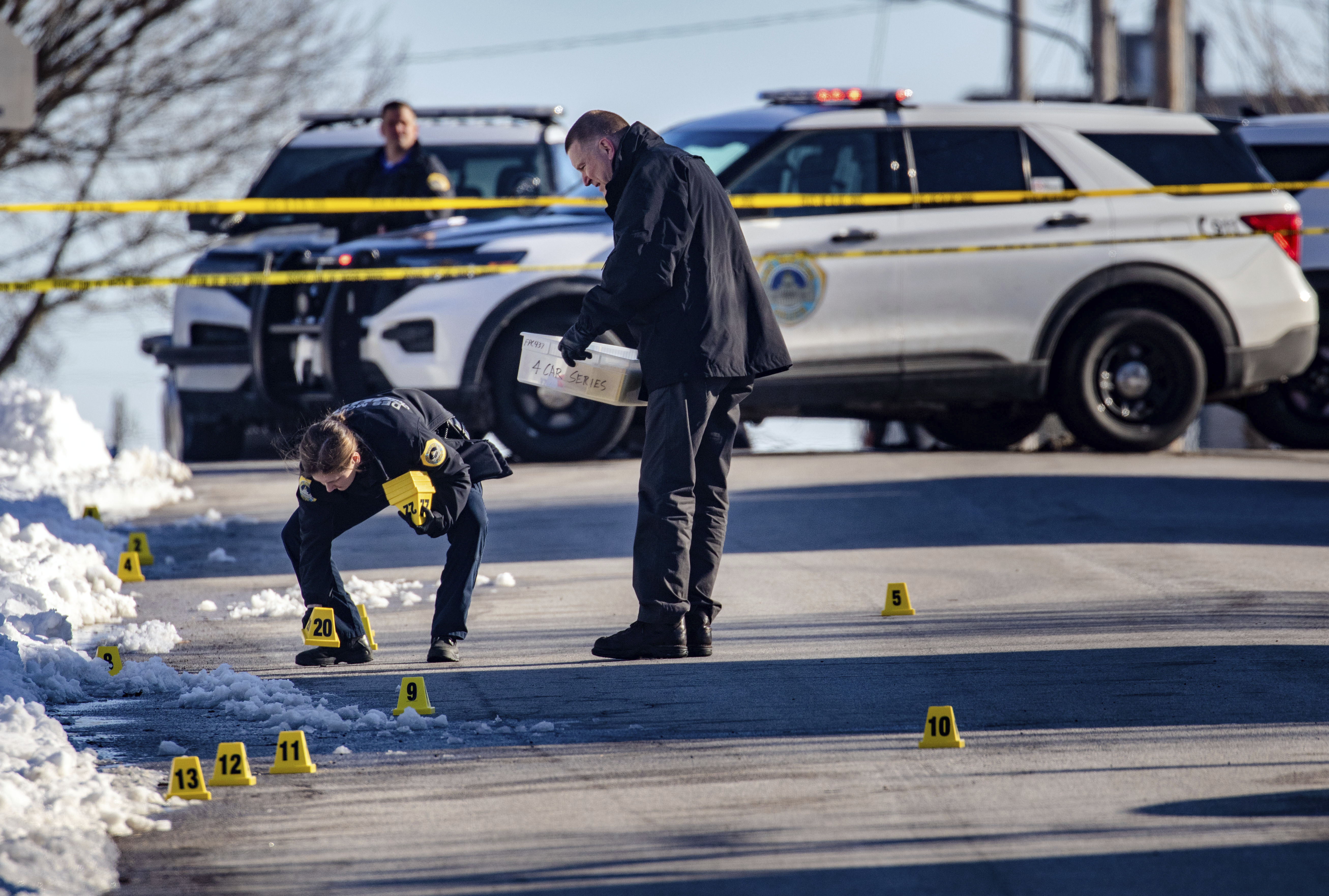 Police investigate a shooting outside of East High School in in Des Moines, Iowa, on Monday, March 7. 