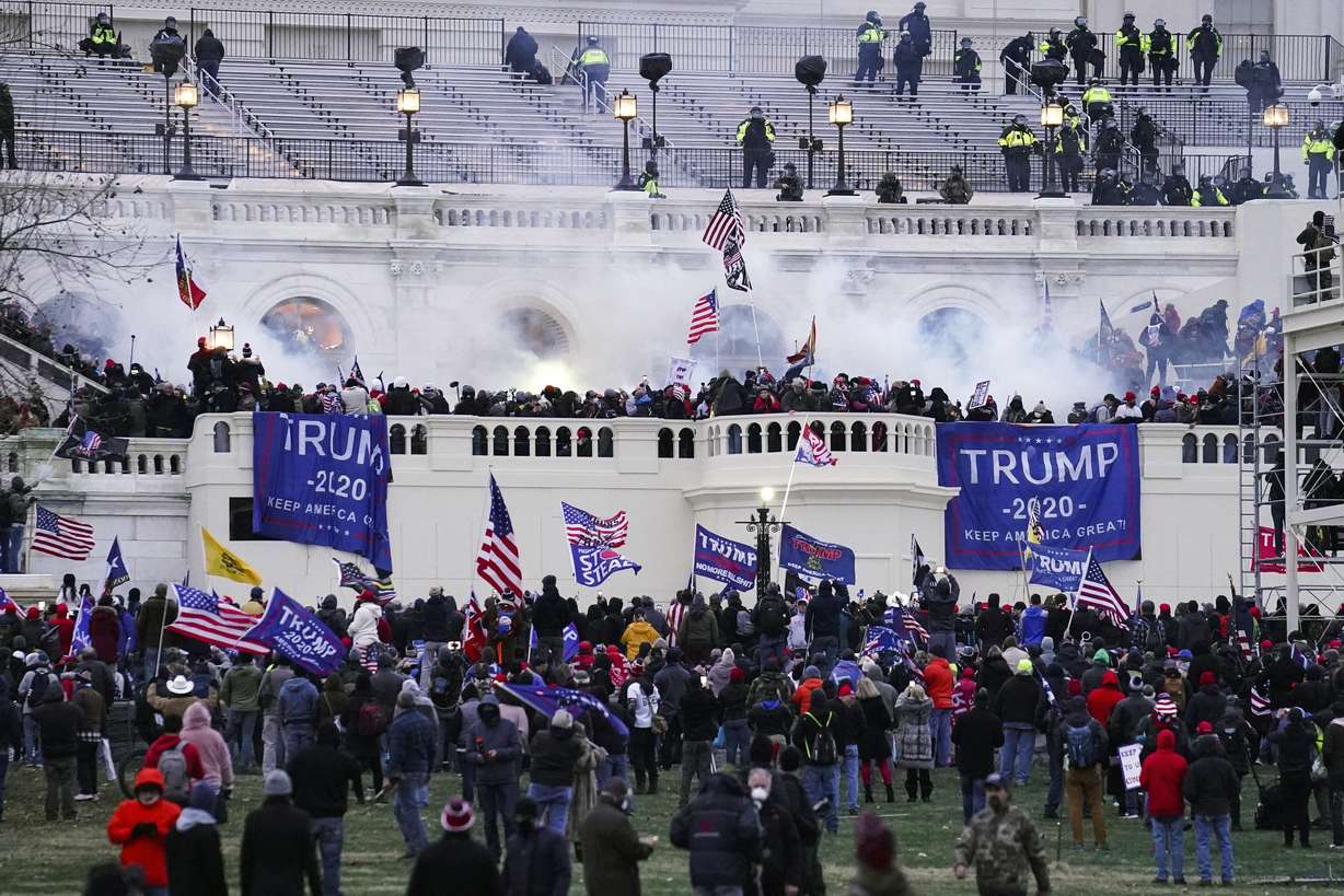 Violent insurrectionists, loyal to President Donald Trump, storm the Capitol in Washington on Jan. 6, 2021. The first trial for one of the hundreds of Capitol riot prosecutions starts this week, with jury selection scheduled to begin Feb. 28, for the case against Guy Wesley Reffitt.