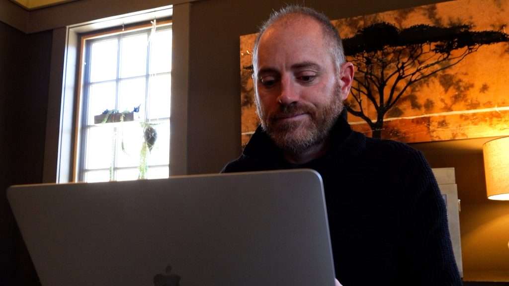 Jon Accarrino sits behind his computer.