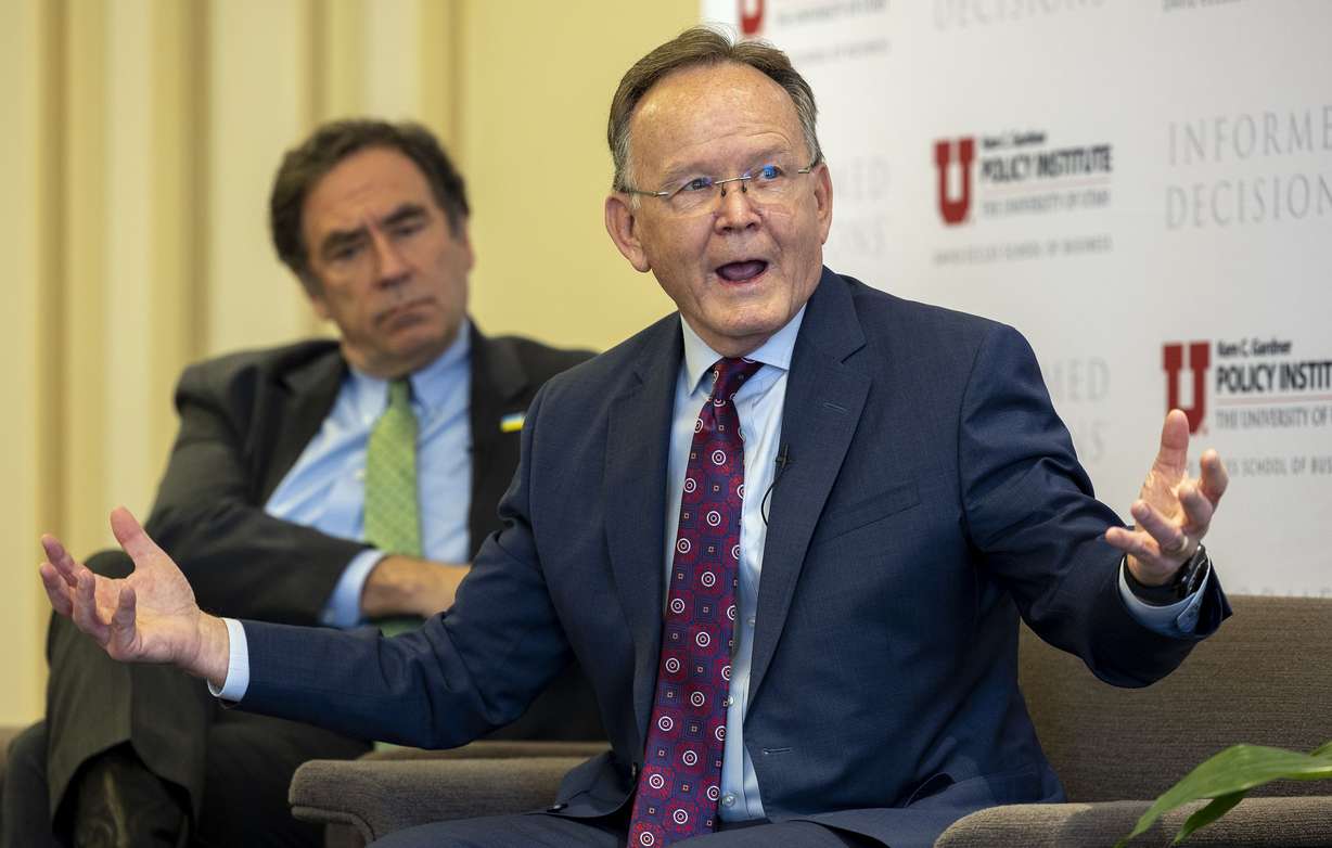 House Minority Leader Brian King, D-Salt Lake City, left, listens as Senate President Stuart Adams, R-Layton, speaks during a panel discussion on the 2022 legislative session at the Thomas S. Monson Center in Salt Lake City on Tuesday.