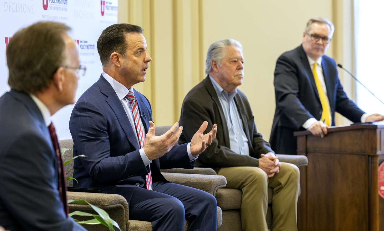 Senate President Stuart Adams, R-Layton, left, House Speaker Brad Wilson, R-Kaysville, and Sen. Gene Davis, D-Salt Lake City, take part on a panel discussion on the 2022 legislative session moderated by Doug Wilks, executive editor of the Deseret News, at the Thomas S. Monson Center in Salt Lake City on Tuesday.