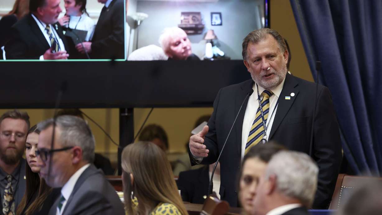 Sen. Curt Bramble, R-Provo, discusses HB11 as Sen. Karen Mayne, D-West Valley City, listens remotely during the last evening of the Utah Legislature’s 2022 general session at the Capitol in Salt Lake City on Friday. Gov. Spencer Cox has vowed to veto the bill, which bans transgender girls from competing in high school sports.