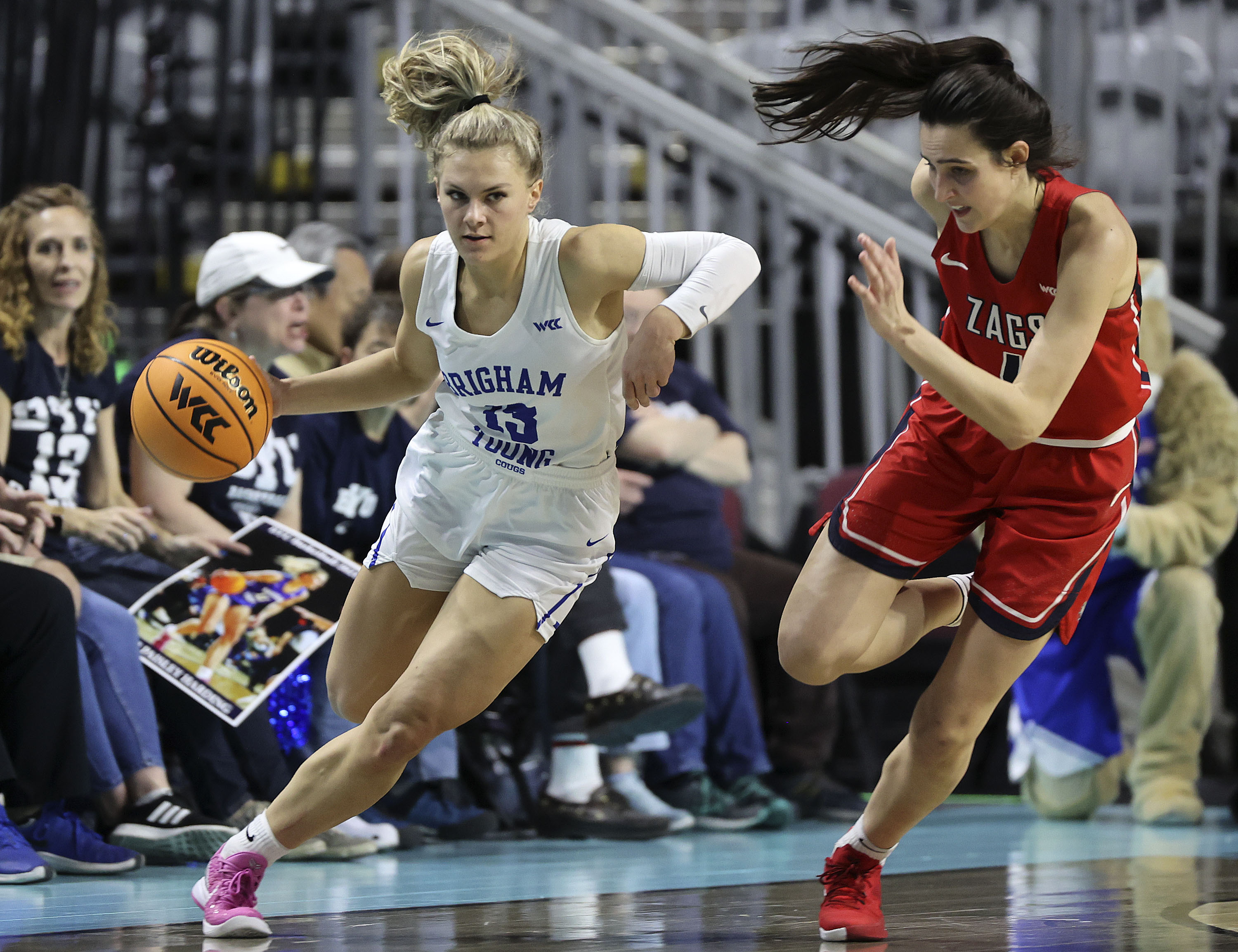 BYU guard Paisley Harding (13) moves around Gonzaga guard Abby O'Connor (4) in the 2022 WCC Women's Basketball Tournament final game at the Orleans Arena in Las Vegas on Tuesday, March 8, 2022.