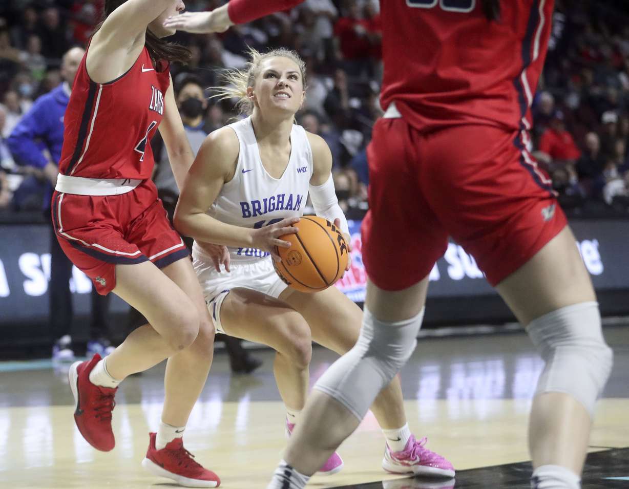 BYU guard Paisley Harding (13) looks to shoot between Gonzaga guard Abby O'Connor (4) and Gonzaga forward Melody Kempton (33) in the 2022 WCC Women's Basketball Tournament final game at the Orleans Arena in Las Vegas on Tuesday, March 8, 2022. BYU lost 59-71.