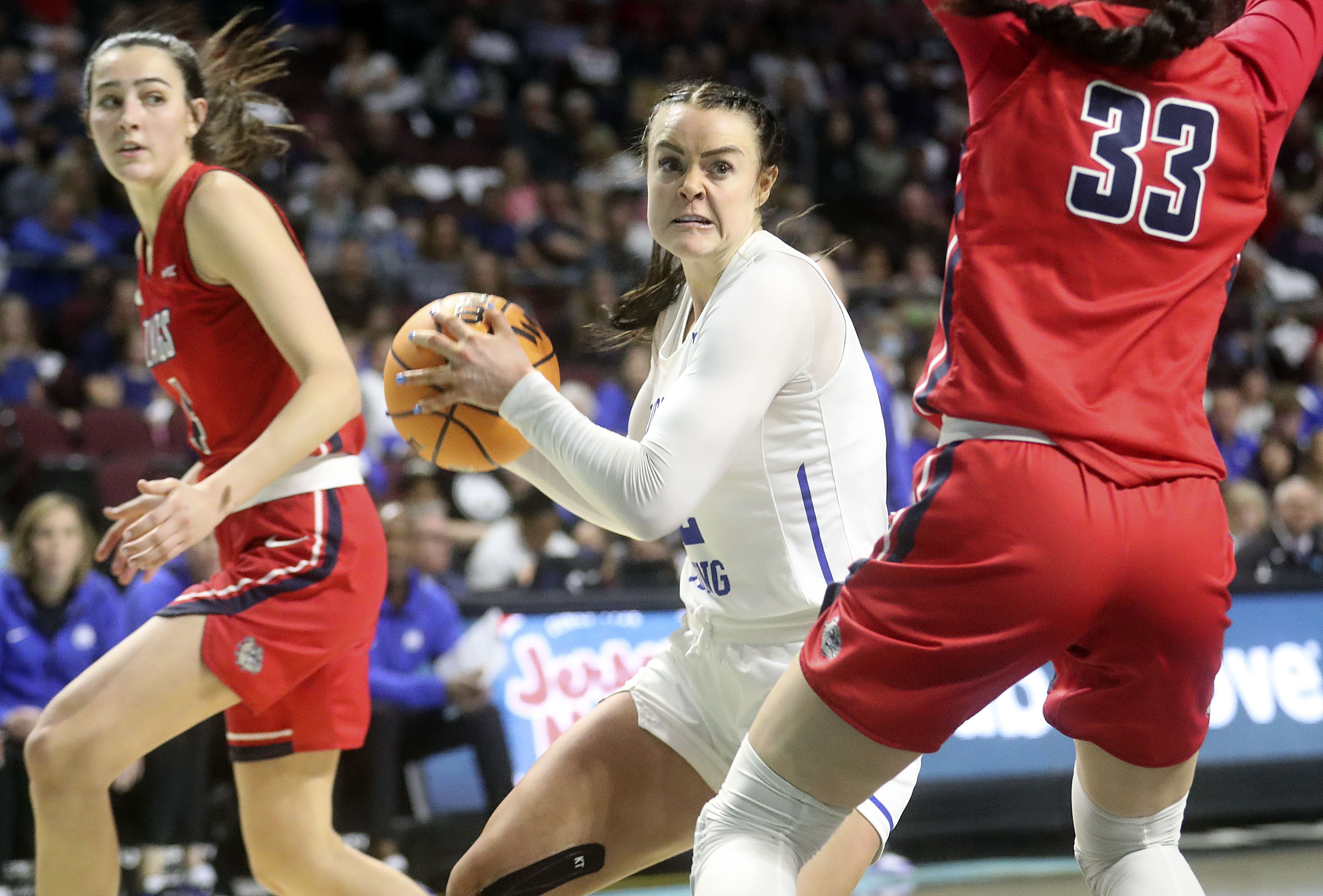 BYU Cougars forward Lauren Gustin goes up for a shot as Gonzaga Bulldogs forward Melody Kempton (33) guards her in the 2022 WCC Women's Basketball Tournament final game at the Orleans Arena in Las Vegas on Tuesday, March 8, 2022. BYU lost 59-71.