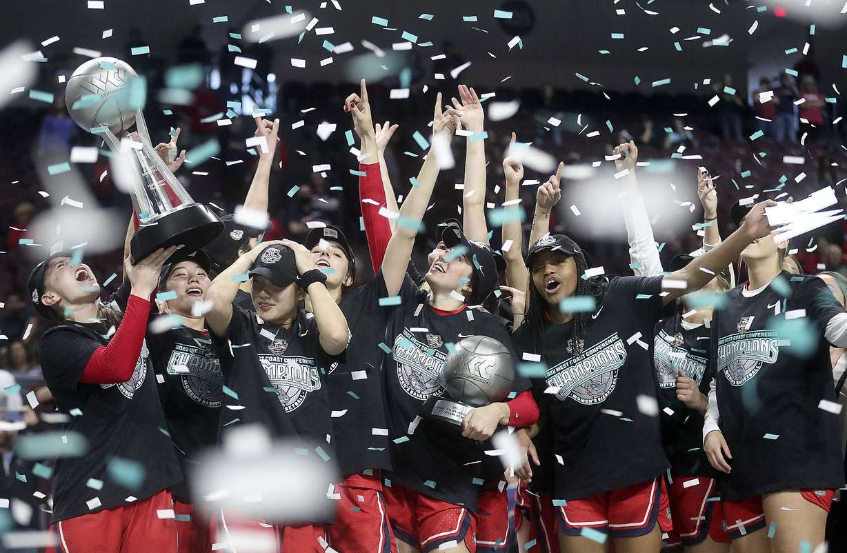 The Gonzaga Bulldogs celebrate winning the 2022 WCC Women's Basketball Tournament final game against the BYU Cougars at the Orleans Arena in Las Vegas on Tuesday, March 8, 2022. BYU lost 59-71.