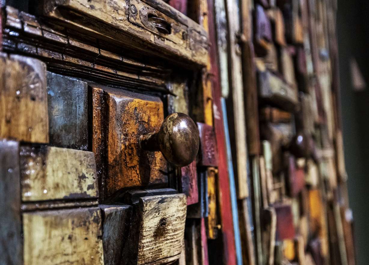 A piece by artist Jean-Marcel St. Jacques, made up of bits of homes destroyed by Hurricane Katrina in New Orleans in 2004, is part of “Handstitched Worlds: The Cartography of Quilts” at the Utah Museum of Fine Arts at the University of Utah in Salt Lake City on Tuesday.