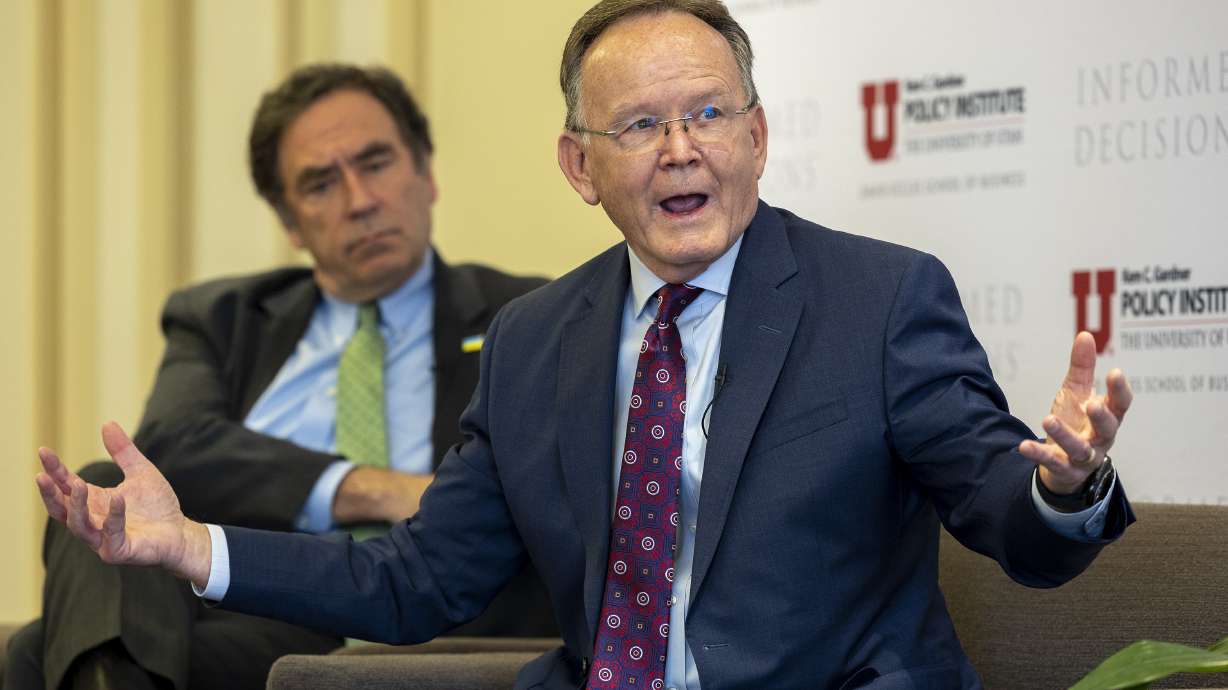 House Minority Leader Brian King, D-Salt Lake City, left, listens as Senate President Stuart Adams, R-Layton, speaks during a panel discussion on the 2022 legislative session at the Thomas S. Monson Center in Salt Lake City on Tuesday. Utah lawmakers could have and should have done better for teachers and classrooms rather than cutting taxes, Utah Democratic legislative leaders said on Tuesday.
