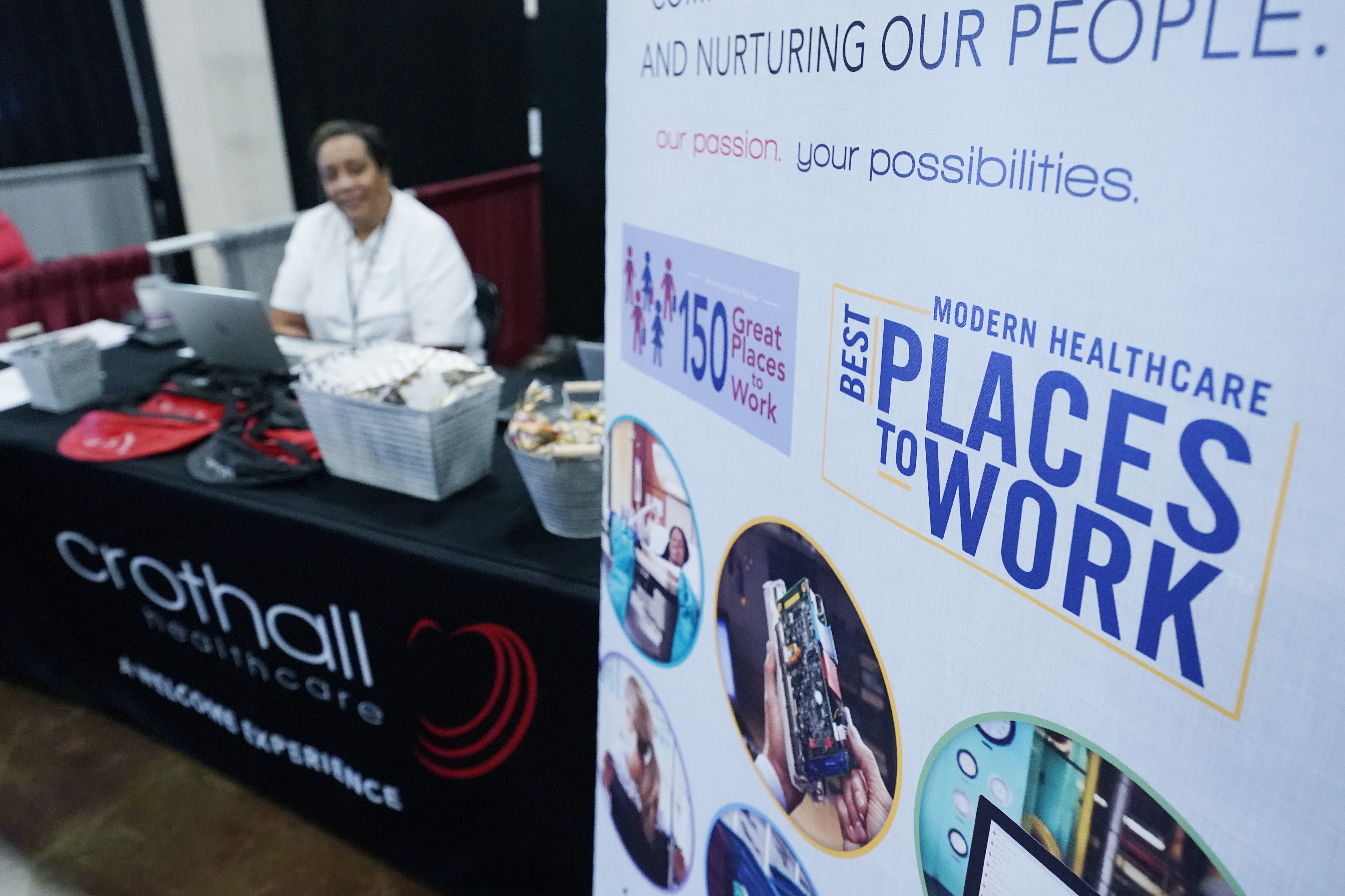 Employers man booths during a job fair in Tupelo, Miss.,  Oct. 12, 2021. U.S. businesses posted a near-record level of open jobs in January 2022.