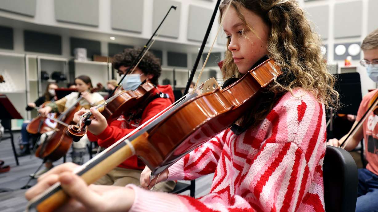 Emily Richard and other orchestra students rehearse at Alta High School in Sandy on Friday, Jan. 21. While Utah schools will receive record funding, it apparently wasn’t enough that education leaders felt comfortable covering school fees with their robust appropriations.