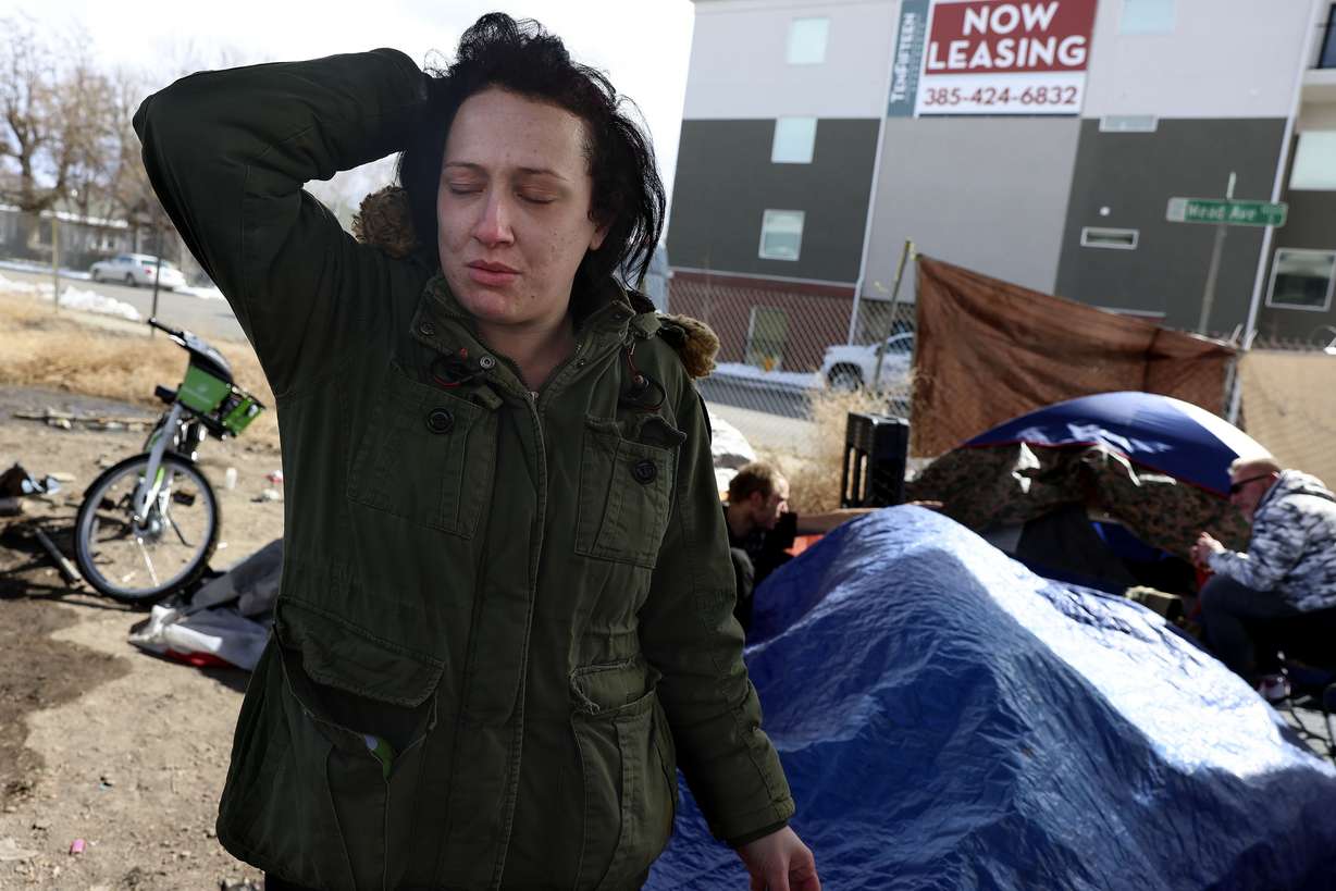 Natasha Woodhouse, 28, hangs out at a homeless camp in Salt Lake City on Wednesday. Salt Lake County’s housing shortage and high home prices have led to the tightest apartment market in the county’s history.