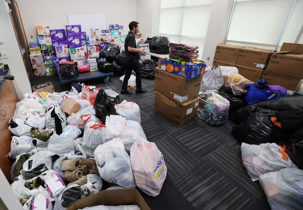 Weston Karren on Wednesday organizes donations for Ukrainian refugees that have been dropped off at the Larry H. Miller Megaplex Theatres at Jordan Commons in Sandy on Wednesday.