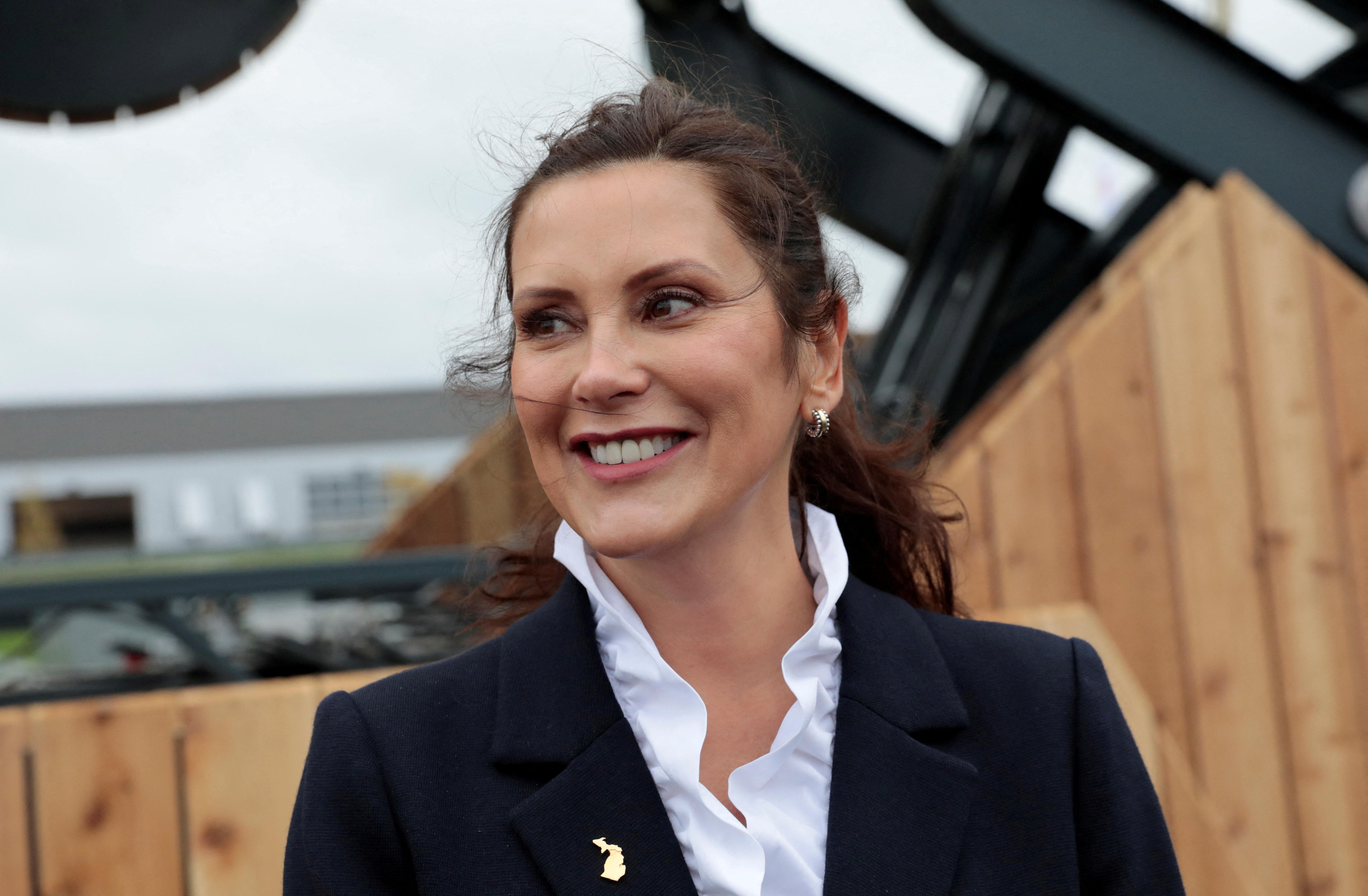 Michigan Gov. Gretchen Whitmer visits an auto show in Pontiac, Michigan, Sept. 21, 2021. Lawyers for four men standing trial on charges they planned to break into Whitmer's vacation home and kidnap her at gunpoint said their clients only engaged in idle talk.