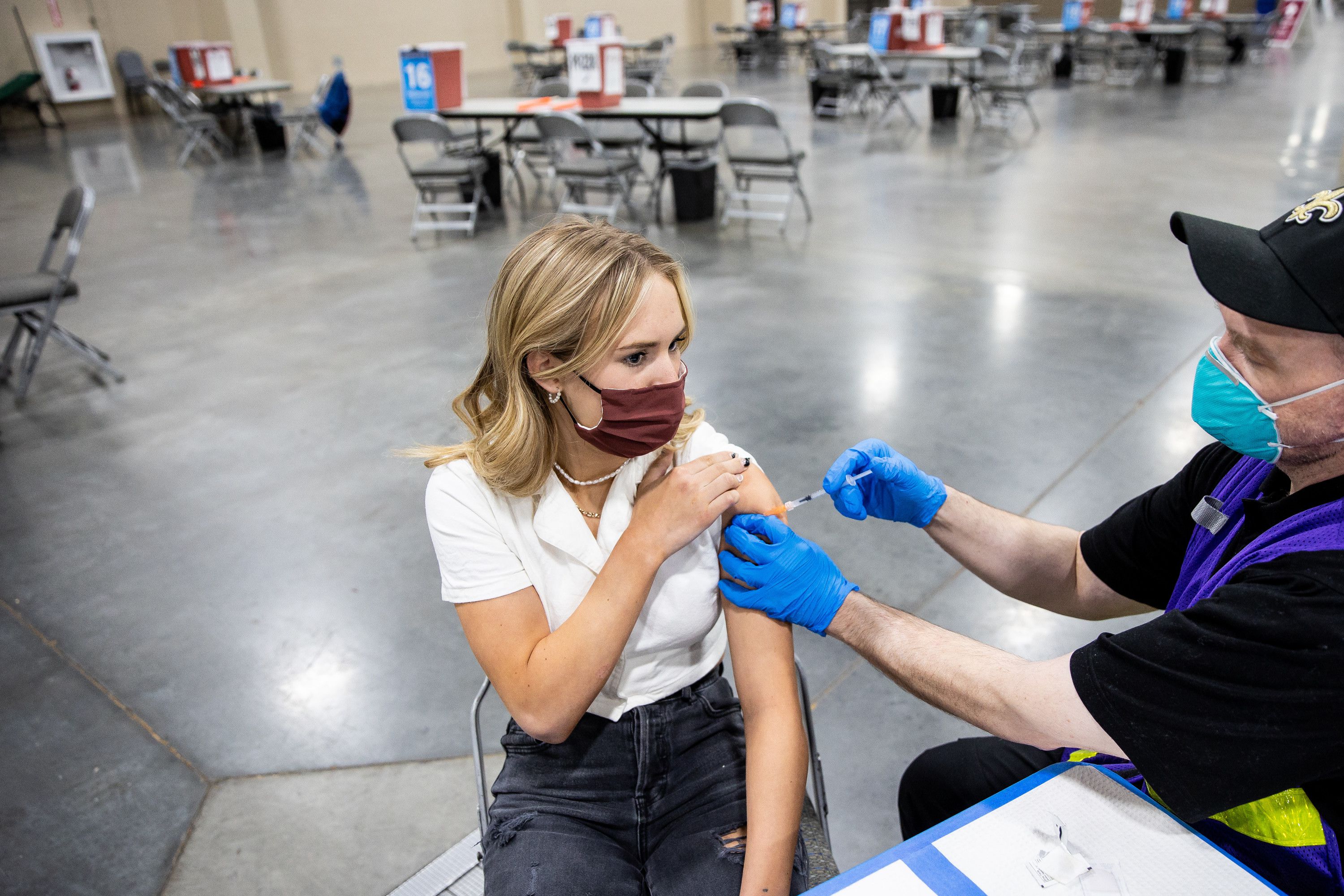 Sofia Carlson, 17, gets her first dose of the Pfizer-BioNTech COVID-19 vaccine from nurse Travis Langston at the Mountain America Expo Center in Sandy on April 22, 2021.