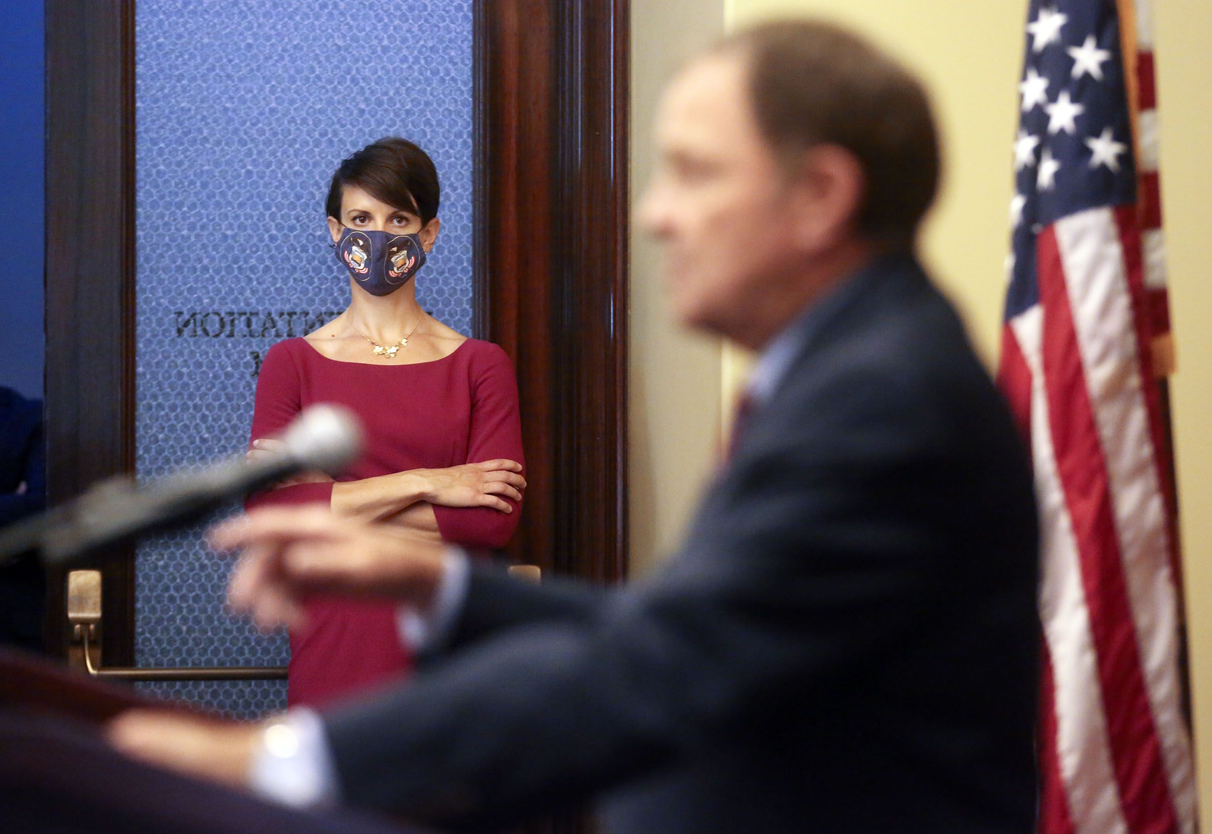 State epidemiologist Dr. Angela Dunn listens as Gov. Gary Herbert speaks during a COVID-19 press conference at the Capitol in Salt Lake City on Oct. 8, 2020.