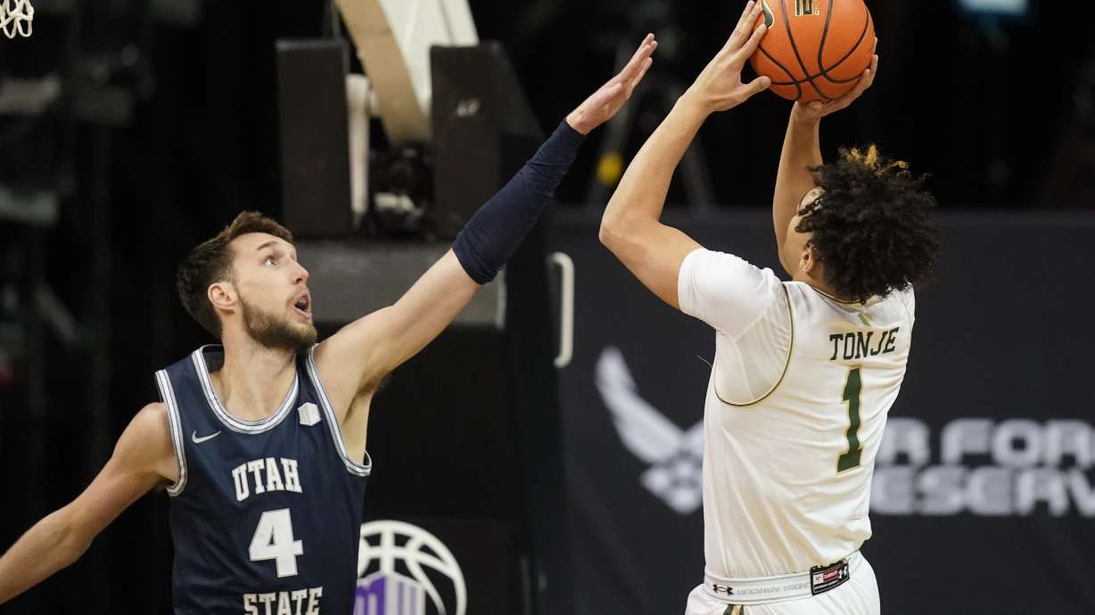 Utah State forward Brandon Horvath (4) guards against Colorado State guard John Tonje (1) during the first half of an NCAA college basketball game in the quarterfinals of Mountain West Conference men's tournament Thursday, March 10, 2022, in Las Vegas.