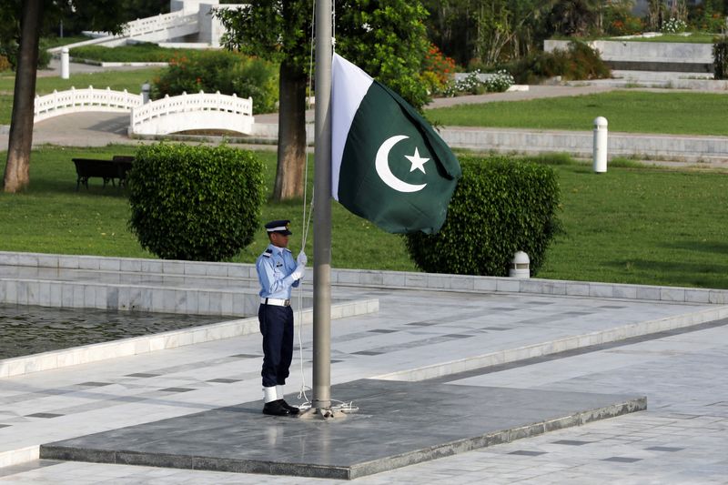 A member of the Pakistan Air Force rehearses flag masting at the mausoleum of Muhammad Ali Jinnah before the Defence Day ceremonies, or Pakistan's Memorial Day, in Karachi, Pakistan September 6, 2020.