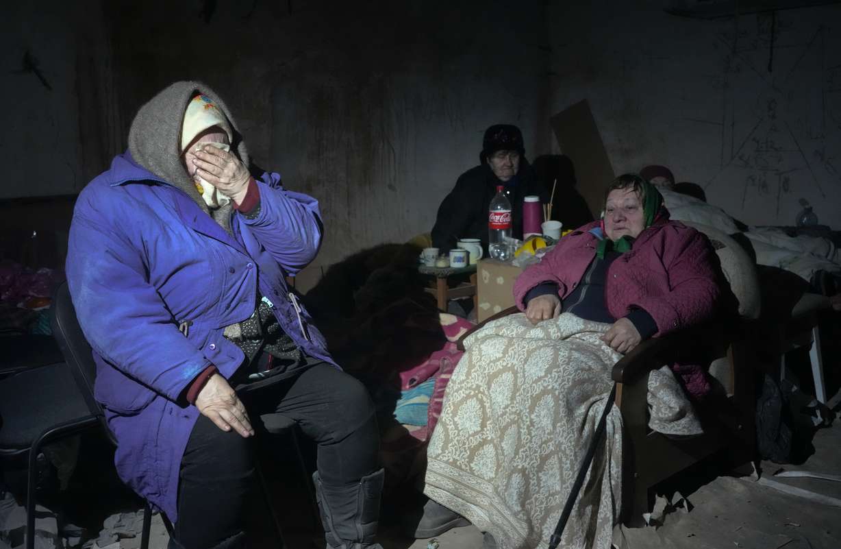 Elderly residents hide in a basement for shelter, with no electricity, water or food in the center of the town of Irpin, some 16 miles northwest of Kyiv, Friday. Kyiv northwest suburbs such as Irpin and Bucha have been enduring Russian shellfire and bombardments for over a week.