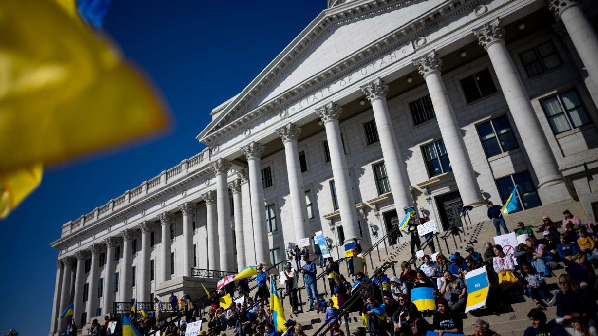 People gather on the steps of the Capitol for a rally against the war in Ukraine at the Capitol in Salt Lake City on Saturday.