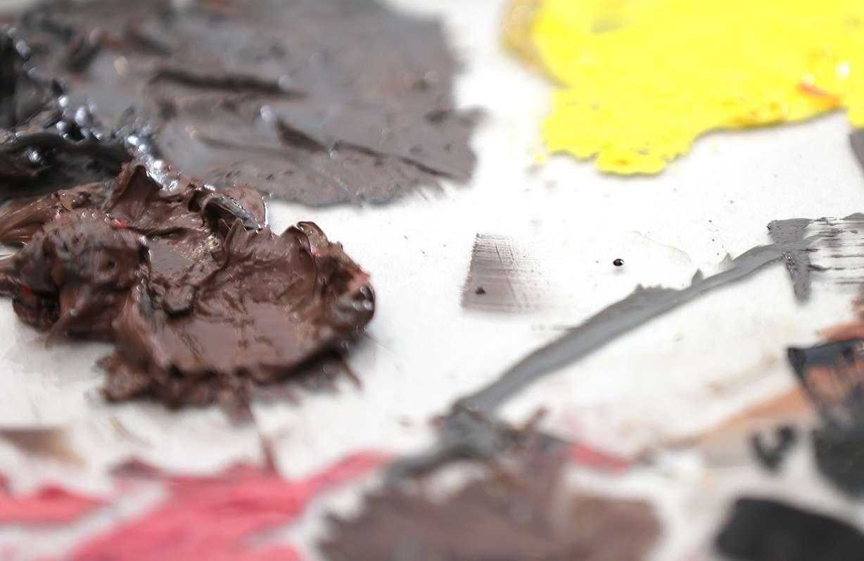 Artist-in-residence Kheng Lim mixes oils at Modern West Fine Art in Salt Lake City on Wednesday.