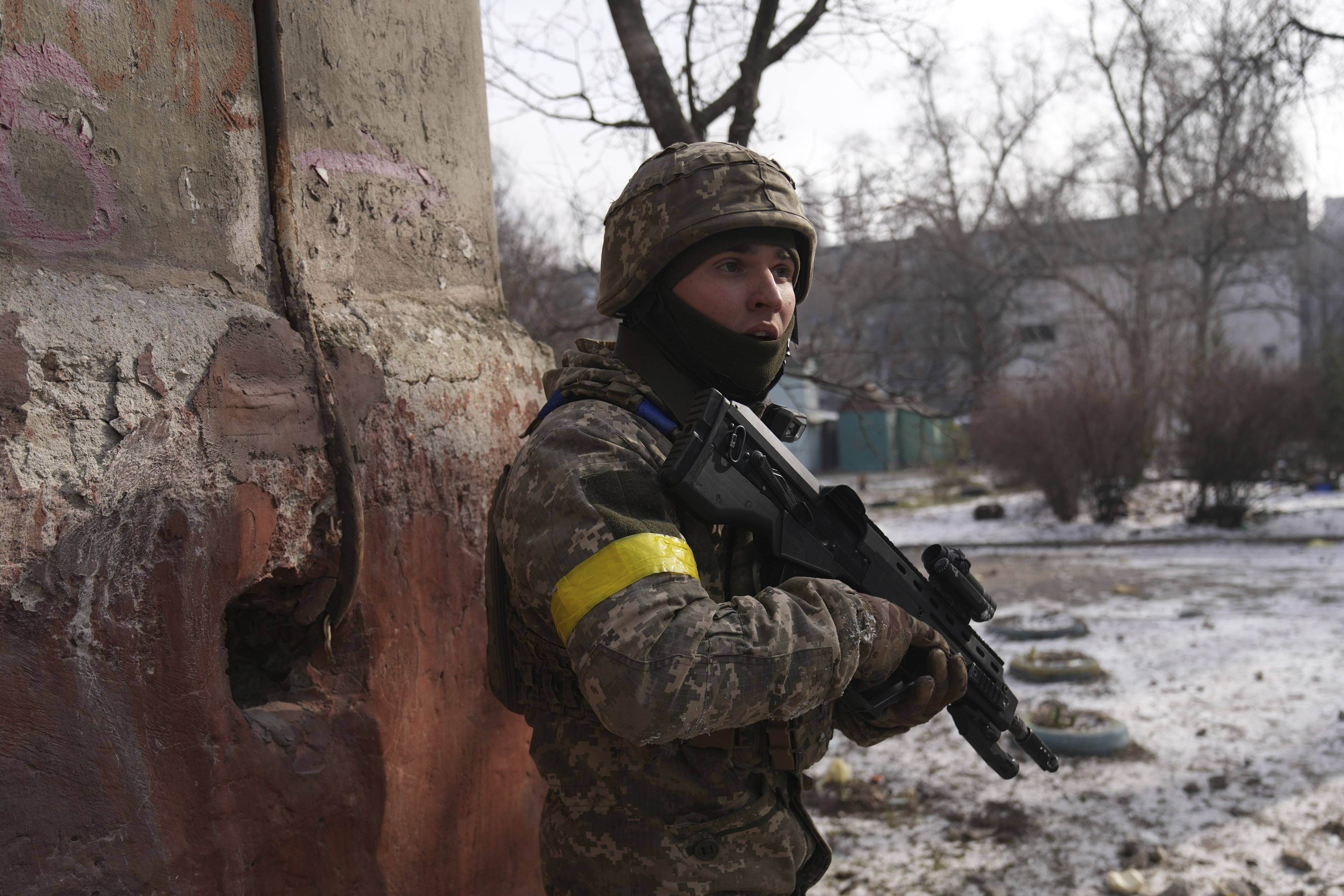 A Ukrainian serviceman guards his position in Mariupol, Ukraine, Saturday. Ukraine’s military says Russian forces have captured the eastern outskirts of the besieged city of Mariupol. In a Facebook update Saturday, the military said the capture of Mariupol and Severodonetsk in the east were a priority for Russian forces. Mariupol has been under siege for over a week, with no electricity, gas or water. 