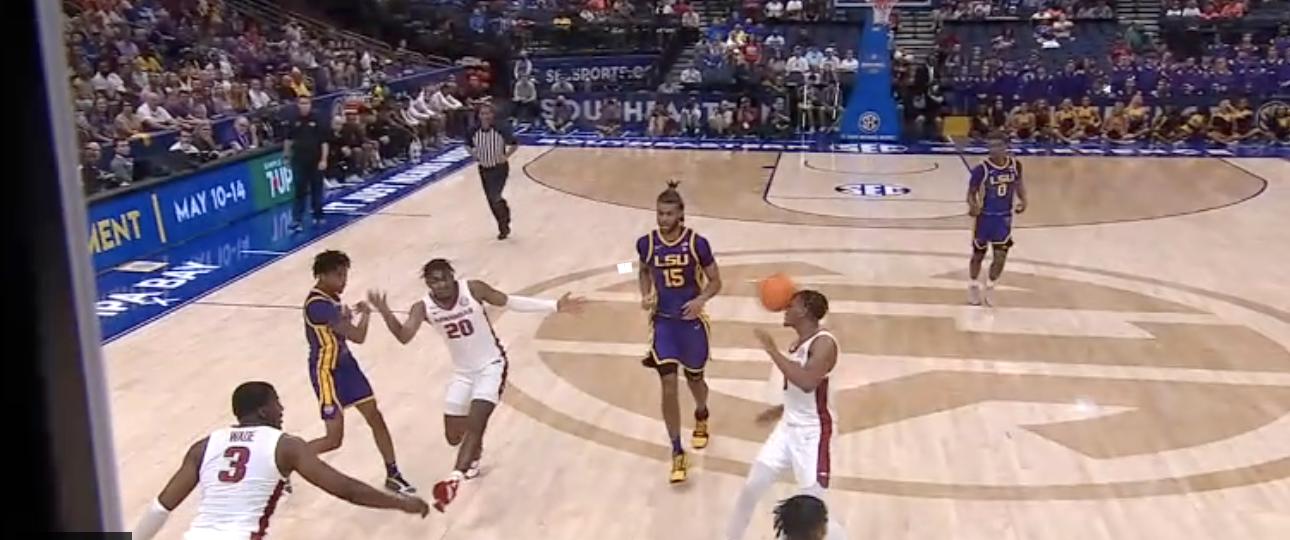 Eric Gaines lasers a pass off an Arkansas defender's face to Brandon Murray for the easy layup in this image from a video posted by ESPN on Friday.