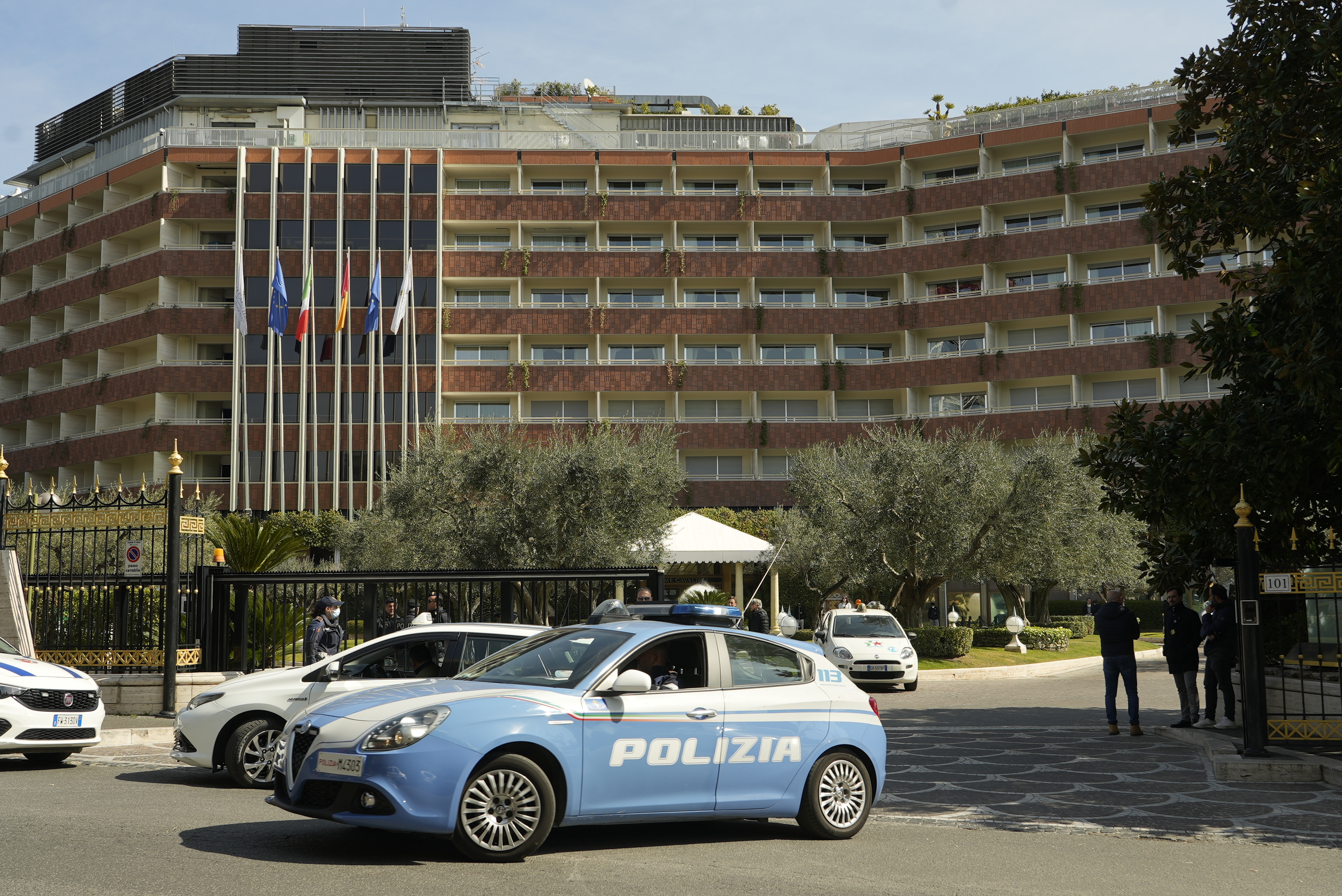 A police car leaves the Cavalieri Hilton hotel in Rome where US national security adviser Jake Sullivan and Chinese foreign minister Yang Jiechi are meeting to talk about the situation in Ukraine, Monday.
