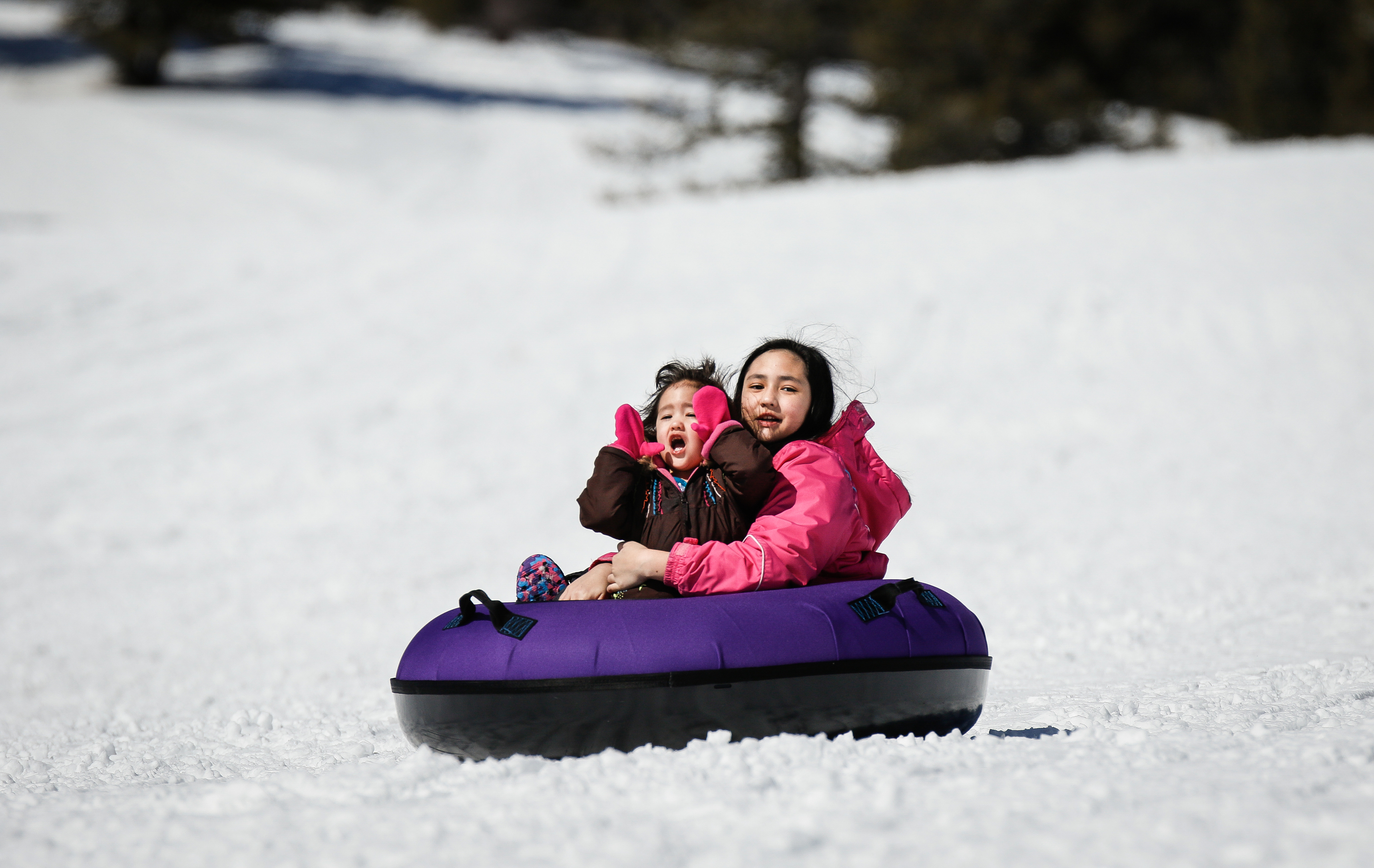 Winter activities including cross country skiing, snowshoeing, tubing and winter fishing on Bear Lake in Garden City.