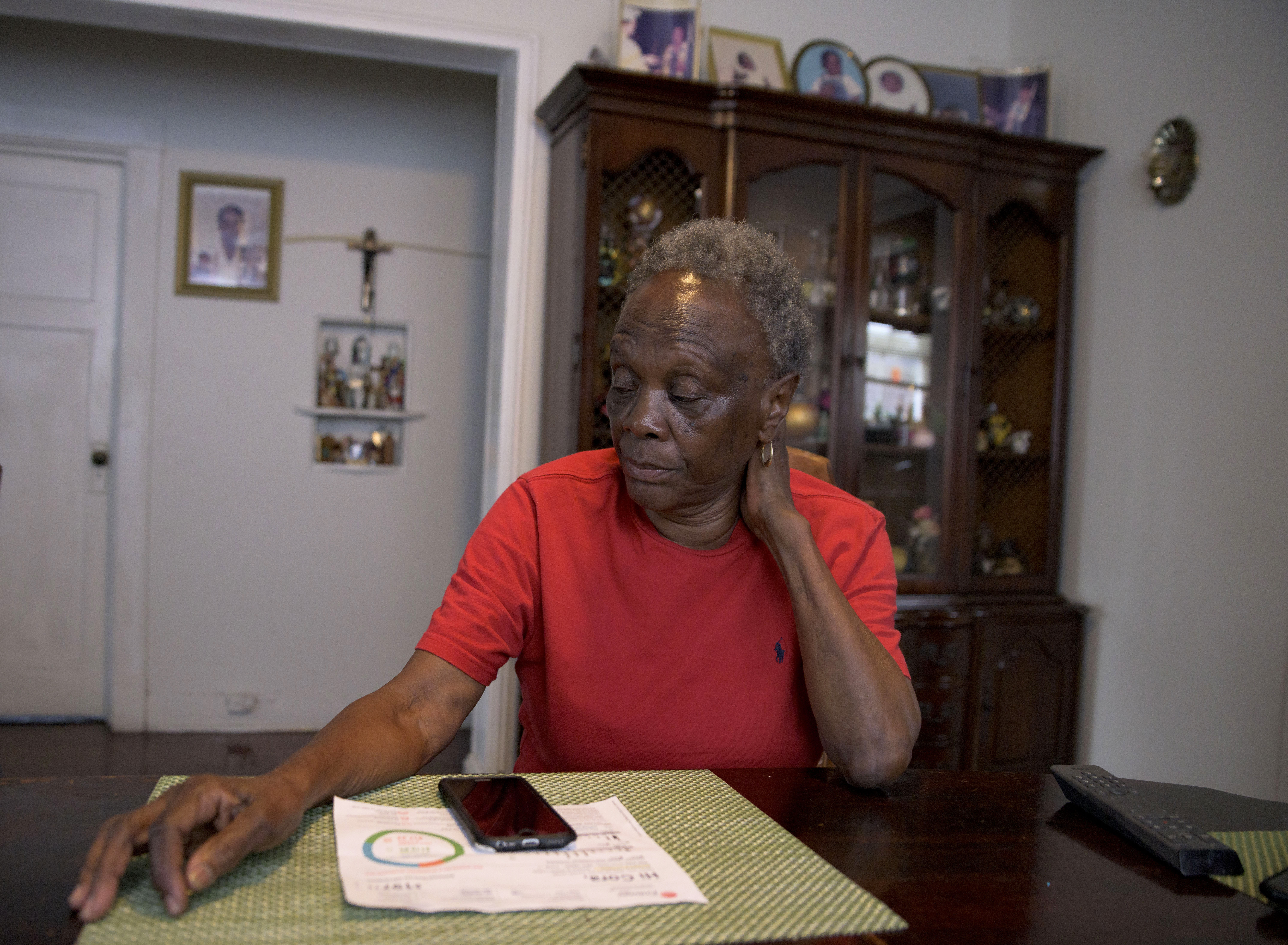 Mary C. Williams sits in her home in New Orleans on Feb. 4. Williams, who lives on a low fixed income, has high utility bills from Entergy, a major utility provider in Louisiana and three other Southern states, causing her to stress about keeping her lights on.