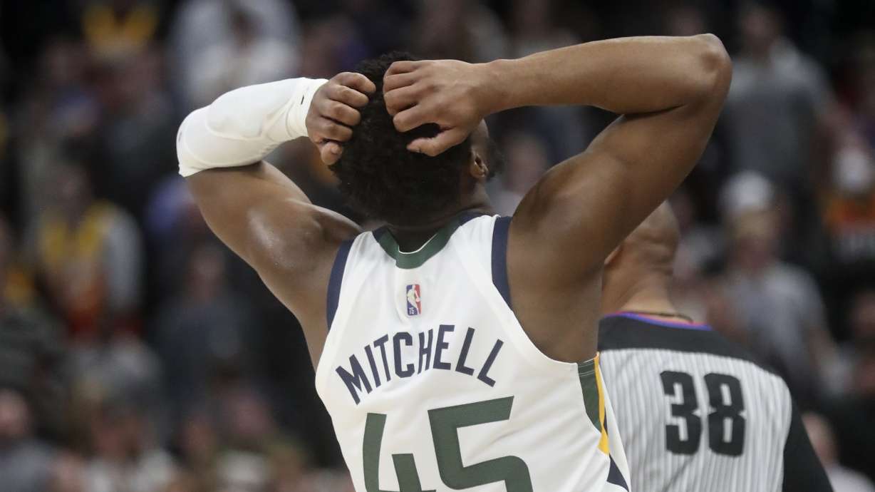 Utah Jazz guard Donovan Mitchell reacts after missing a shot during an NBA game. On Wednesday, the Jazz were throttled by Boston.