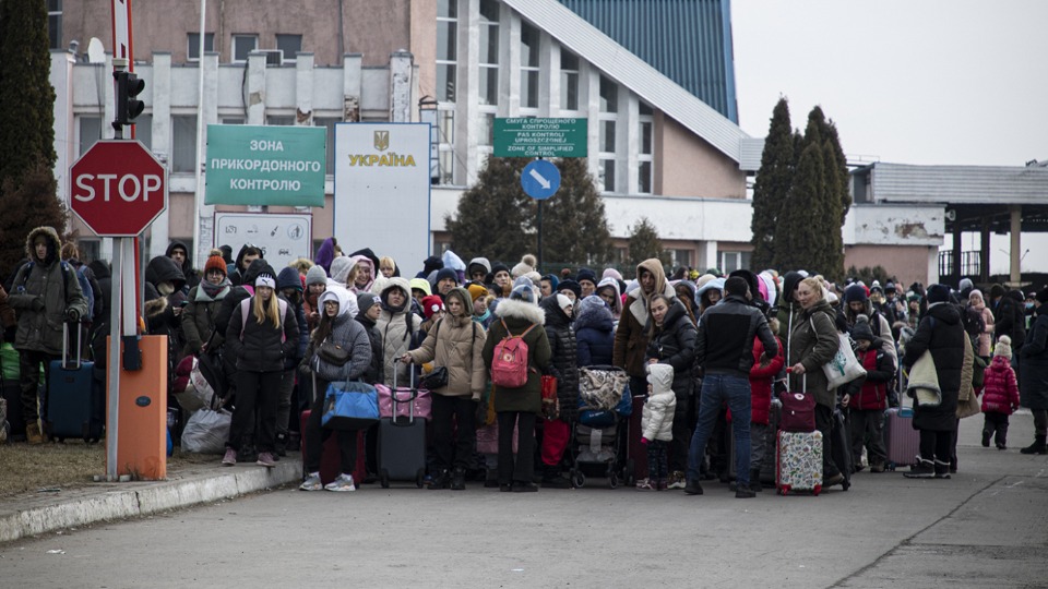 Refugees on the Ukrainian side of the Krakovets Polish border crossing on March 4. The Church of Jesus Christ of Latter-day Saints on Monday announced a $4 million donation to help Ukrainian refugees. 