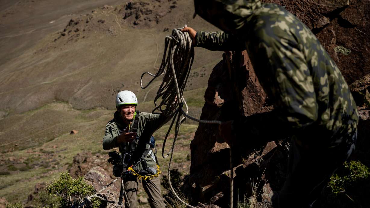 Hawkwatch International research associate Dustin Maloney, left, and field biologist Jayden Skelly prepare rigging so Maloney can enter two golden eagle nests on Antelope Island on May 19, 2021. Antelope Island was the third-most visited Utah state park in 2021.