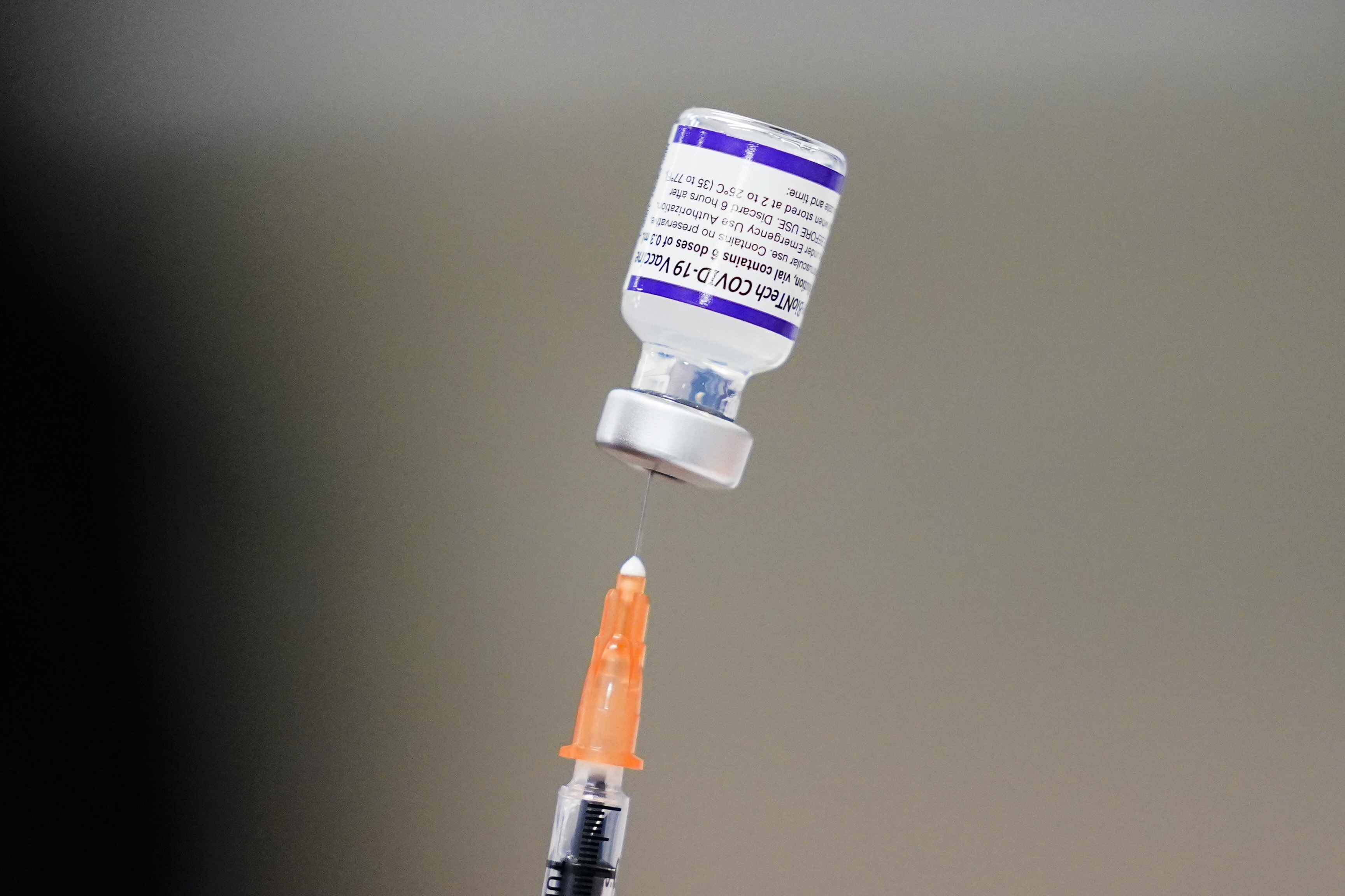 A syringe is prepared with the Pfizer COVID-19 vaccine at a vaccination clinic at the Keystone First Wellness Center in Chester, Pa., on Dec. 15, 2021. The Utah Department of Health reported 173 new COVID-19 cases, as well as five additional deaths, on Thursday. 