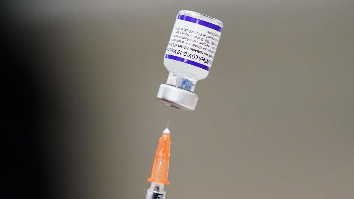 A syringe is prepared with the Pfizer COVID-19 vaccine at a vaccination clinic at the Keystone First Wellness Center in Chester, Pa., on Dec. 15, 2021. The Utah Department of Health reported 173 new COVID-19 cases, as well as five additional deaths, on Thursday.