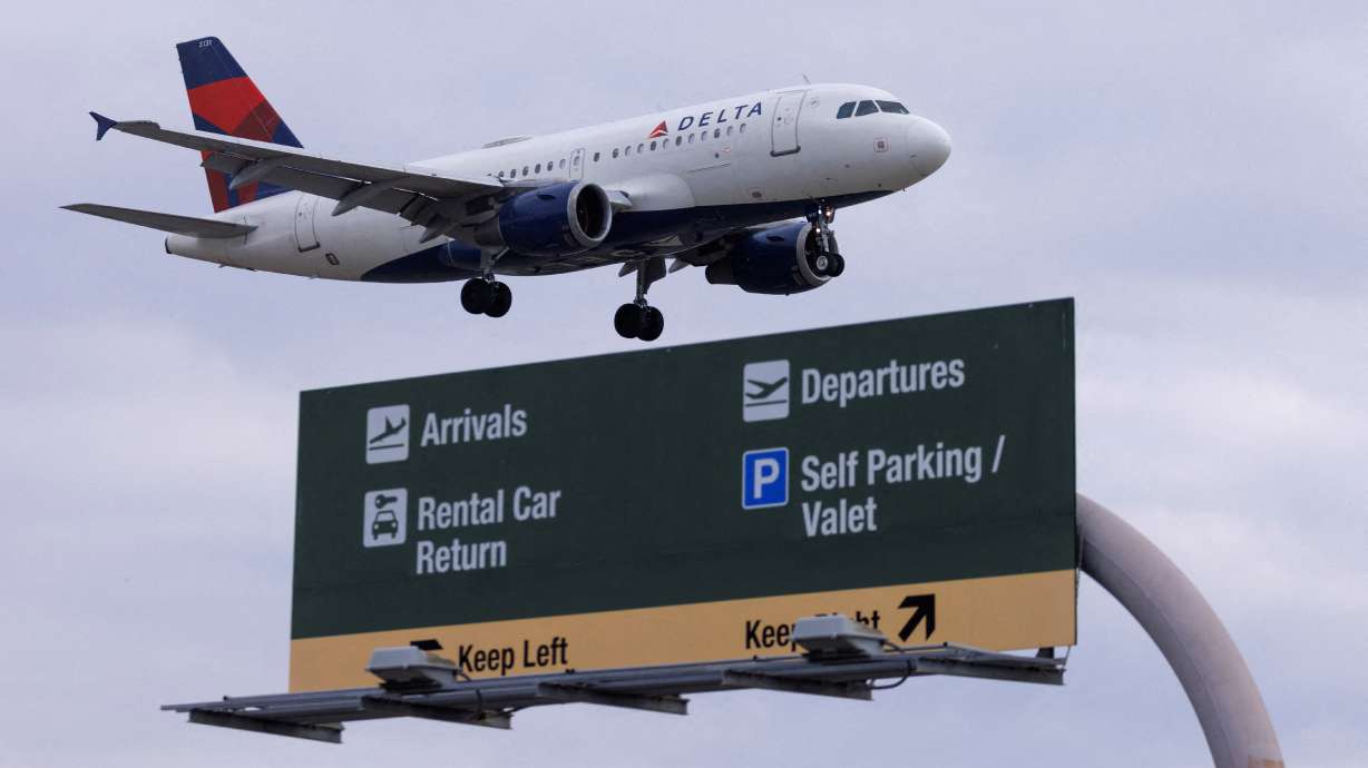 A Delta Air Lines commercial aircraft approaches to land at John Wayne Airport in Santa Ana, California, on Jan. 18. U.S. carriers on Tuesday said travel demand would remain strong enough to help them offset a run-up in fuel costs with higher fares.