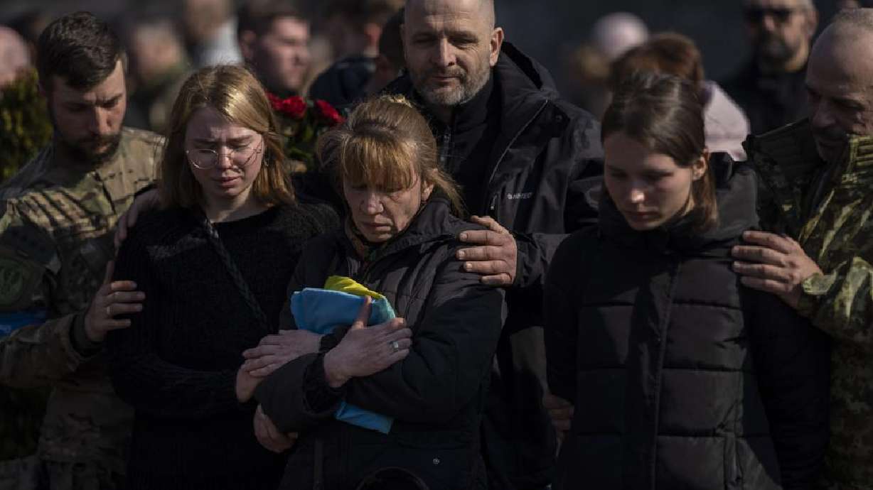 Relatives and friends attend the funeral of Ukrainian Col. Oleg Yaschyshyn in Lviv, Ukraine, Tuesday. Yaschyshyn was killed during Sunday's Russian missile strike on a military training base near Ukraine's western border with NATO member Poland.
