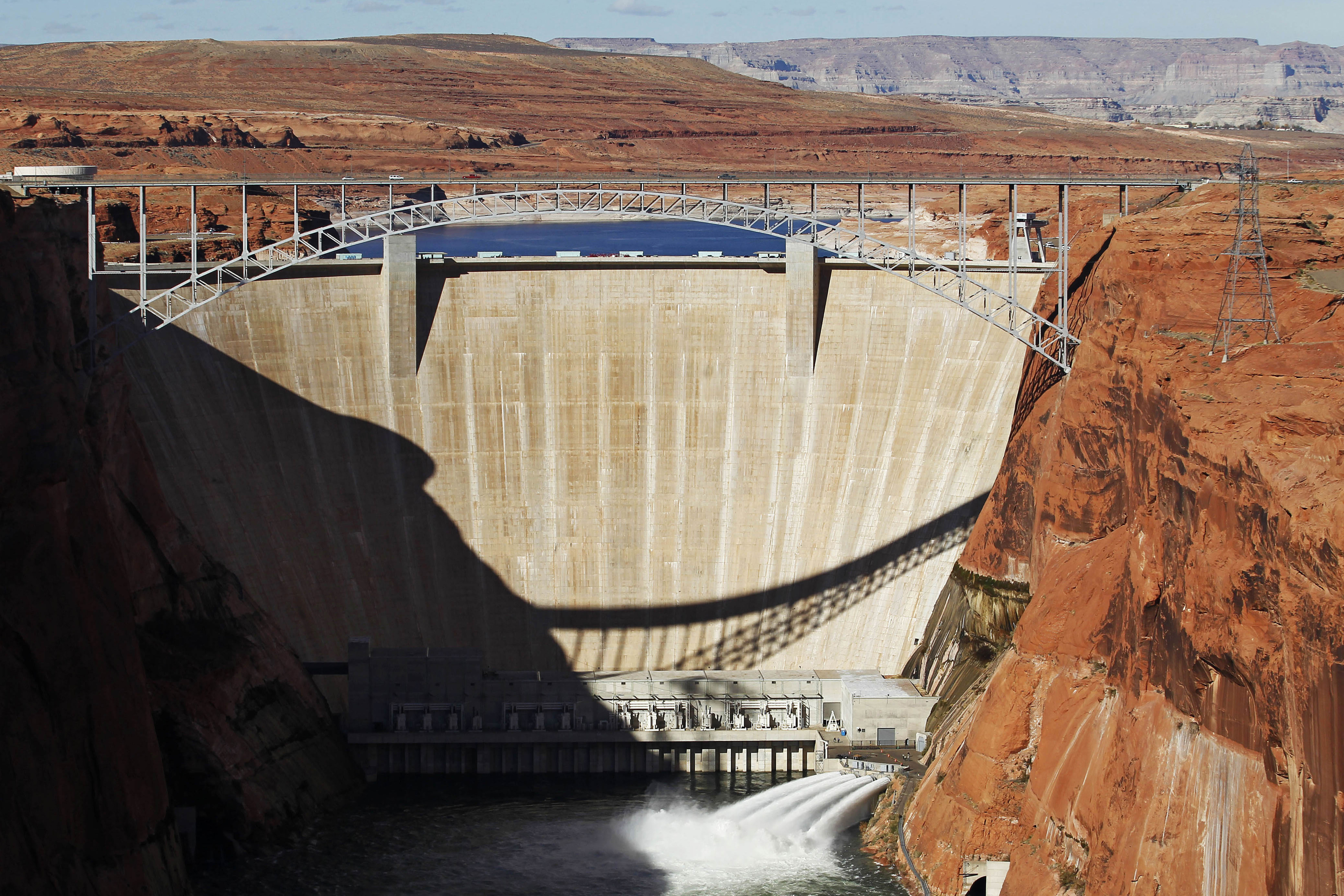 Water is released into the Colorado River at the Glen Canyon Dam in Page, Ariz., on Nov. 19, 2012. The elevation of Lake Powell fell below 3,525 feet, a record low that surpasses a critical threshold at which officials have long warned signals their ability to general hydropower is in jeopardy.