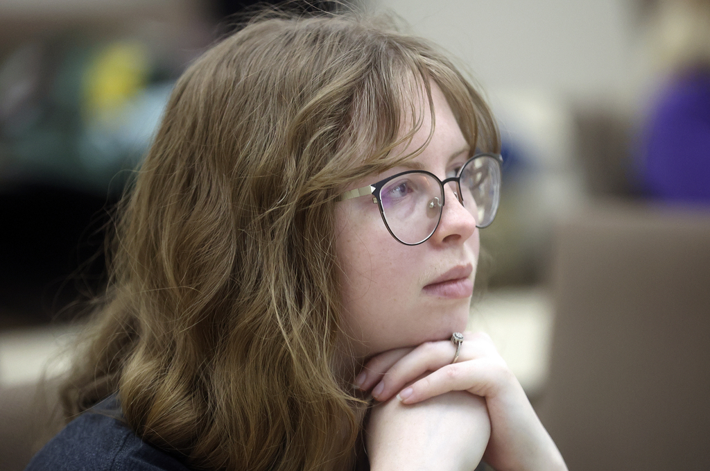 Kennedy Robins, a Weber State University junior studying multimedia journalism and communications and The Signpost assistant photography editor, listens as photojournalist Lynsey Addario, who is currently covering the war in Ukraine for The New York Times, talks about her work during a video call with students and staff at the university's Elizabeth Hall in Ogden on Tuesday.