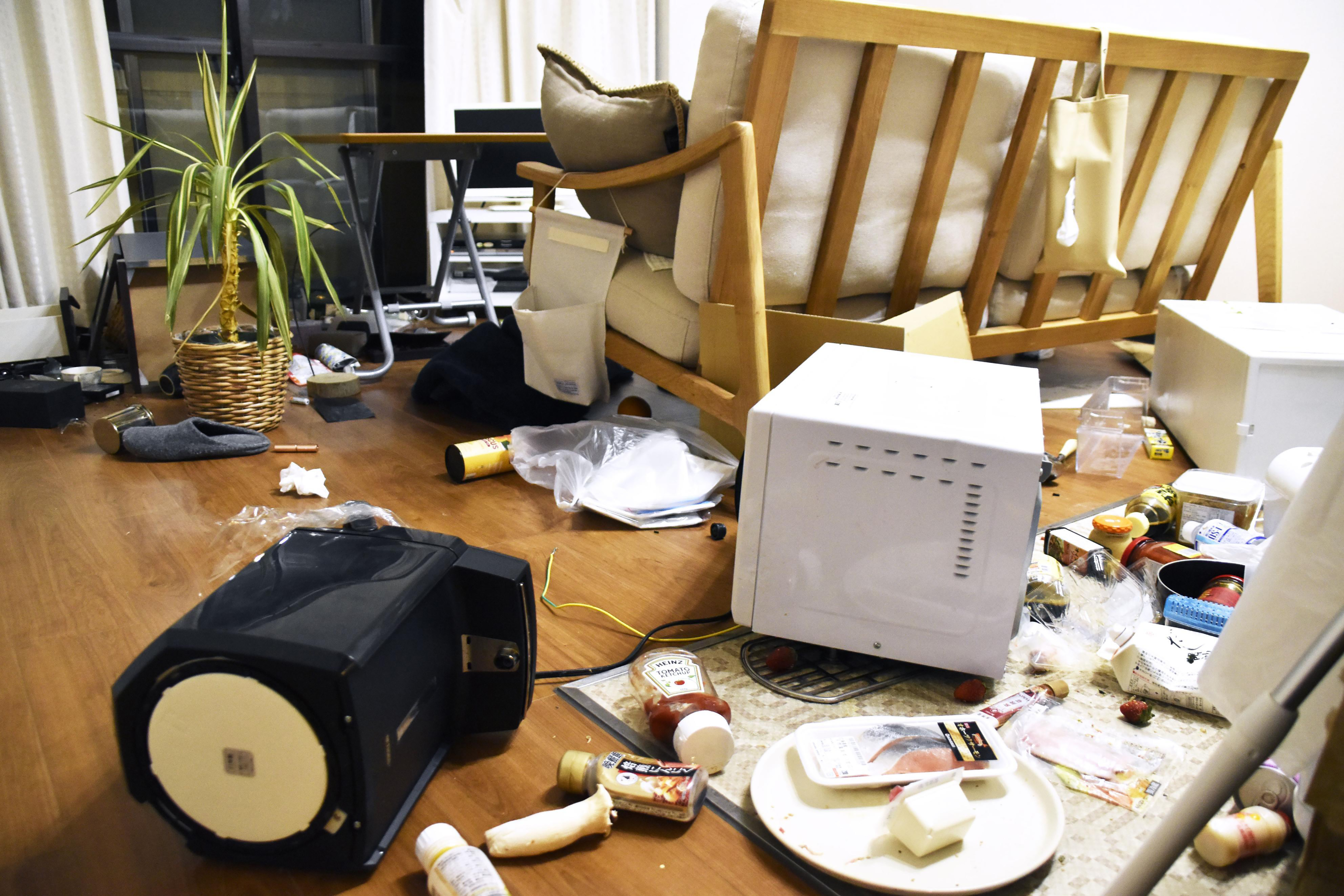 Furniture and electrical appliances are scattered at an apartment in Fukushima, northern Japan, on Wednesday, following an earthquake. A powerful earthquake shook off the coast of Fukushima, triggering a tsunami advisory.
